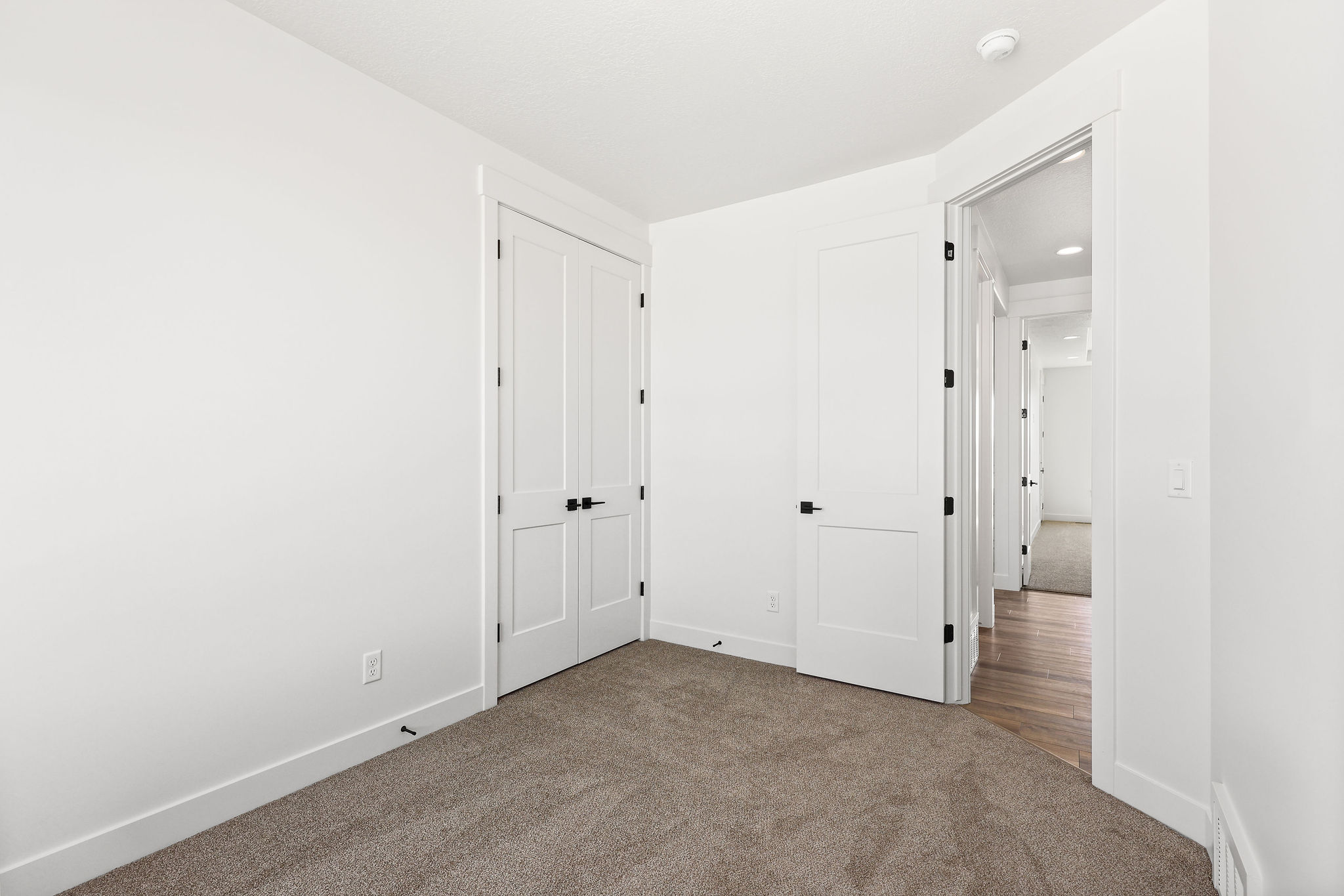 Neutral-toned carpeting paired with white walls