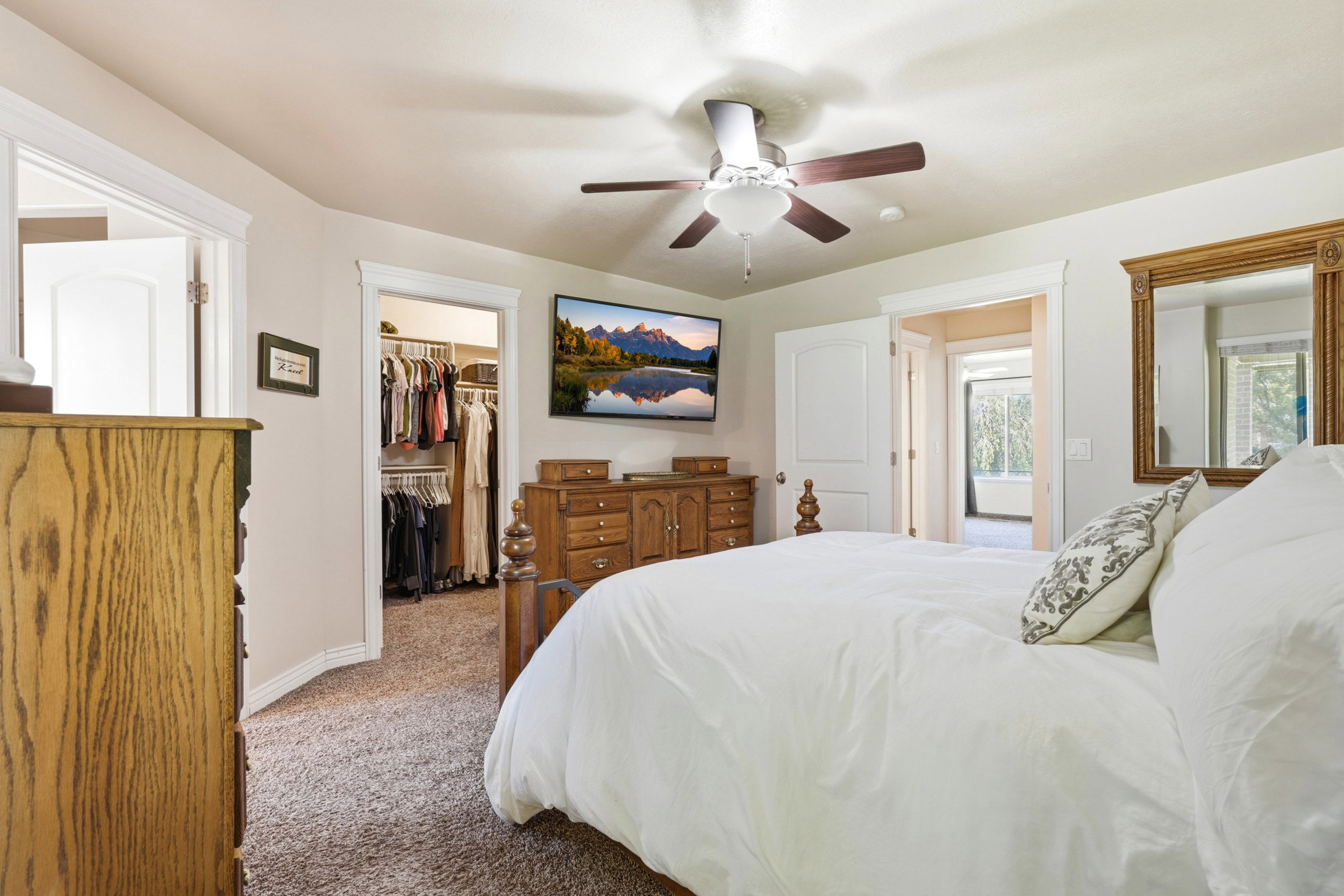 Neutral wall paint complemented by white trim and doors