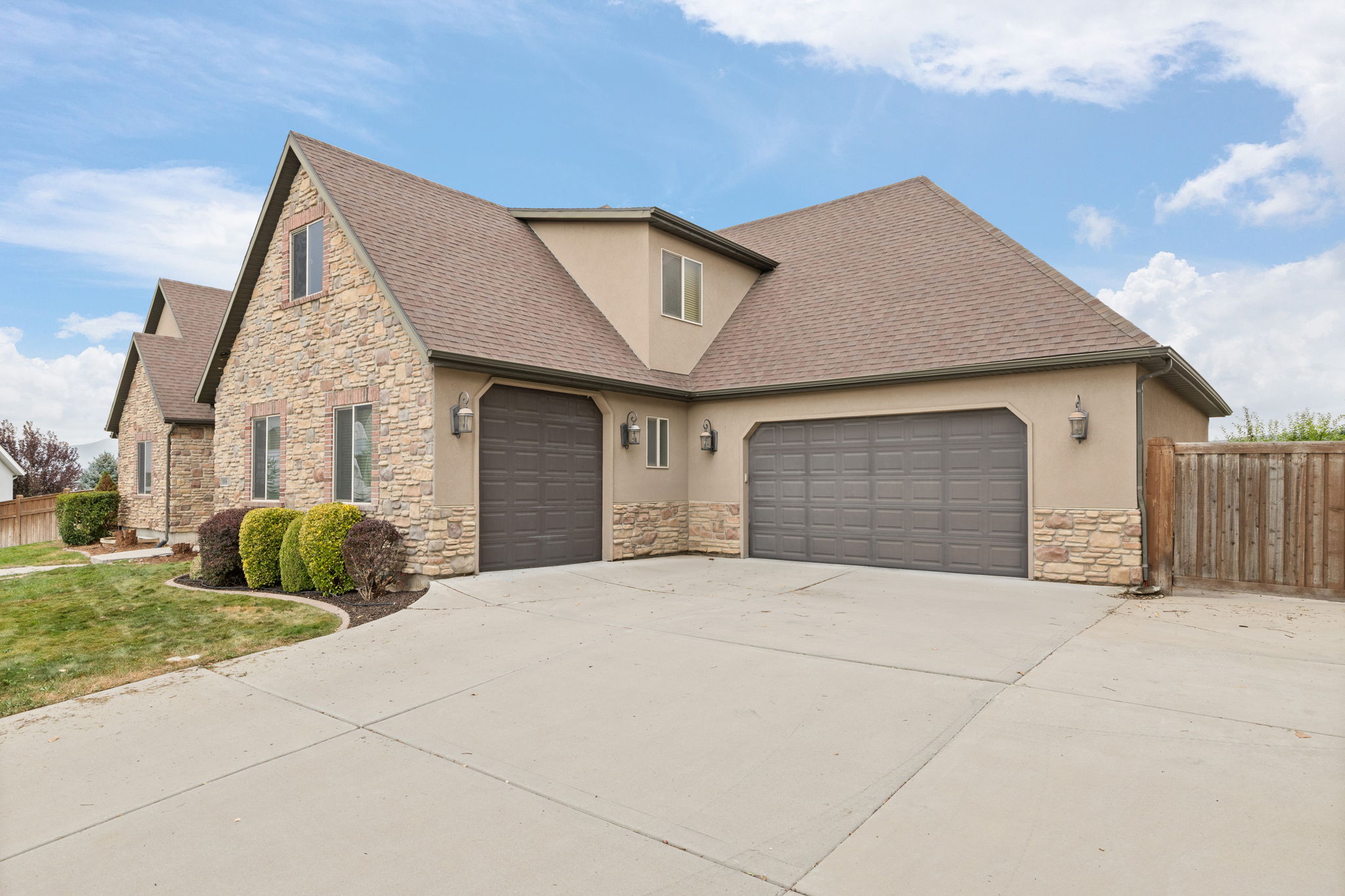 Stone and stucco exterior with multiple gables
