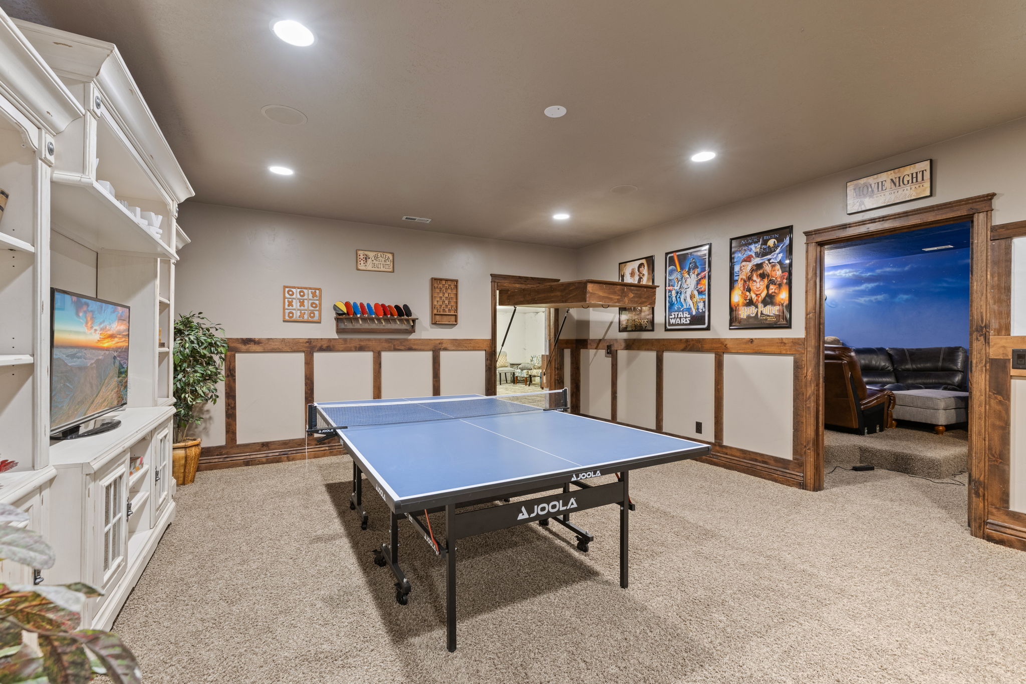 Entertainment space featuring recessed lighting and a neutral carpeted floor