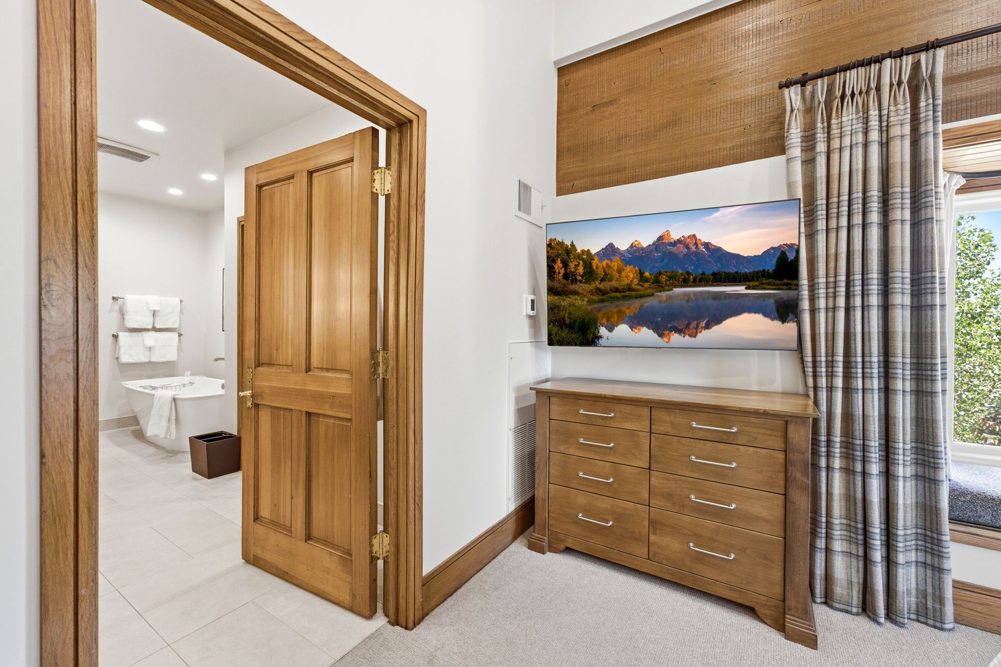 Wood-paneled accent wall with a wall-mounted display