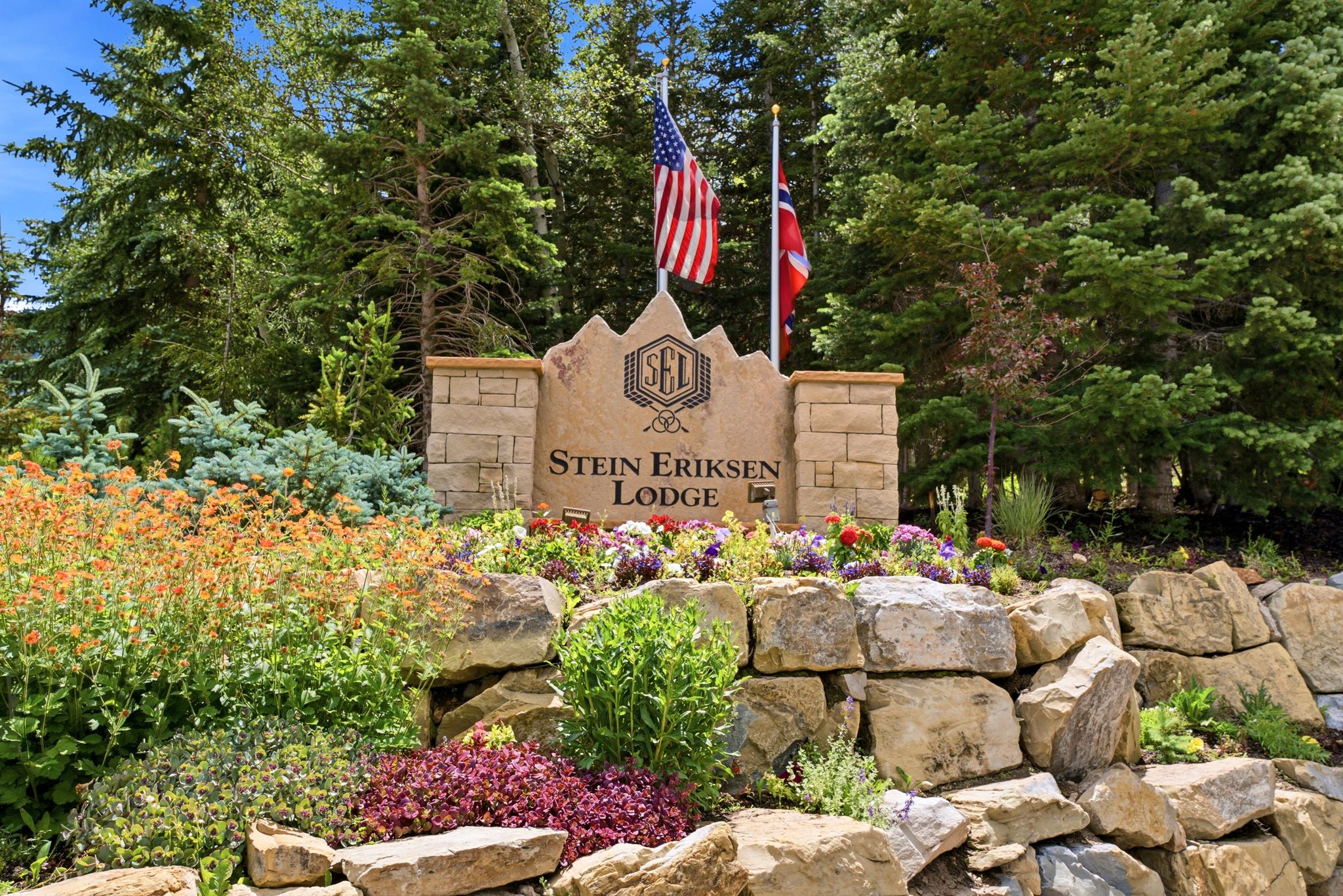 Stone entry monument featuring "Stein Eriksen Lodge" inscription
