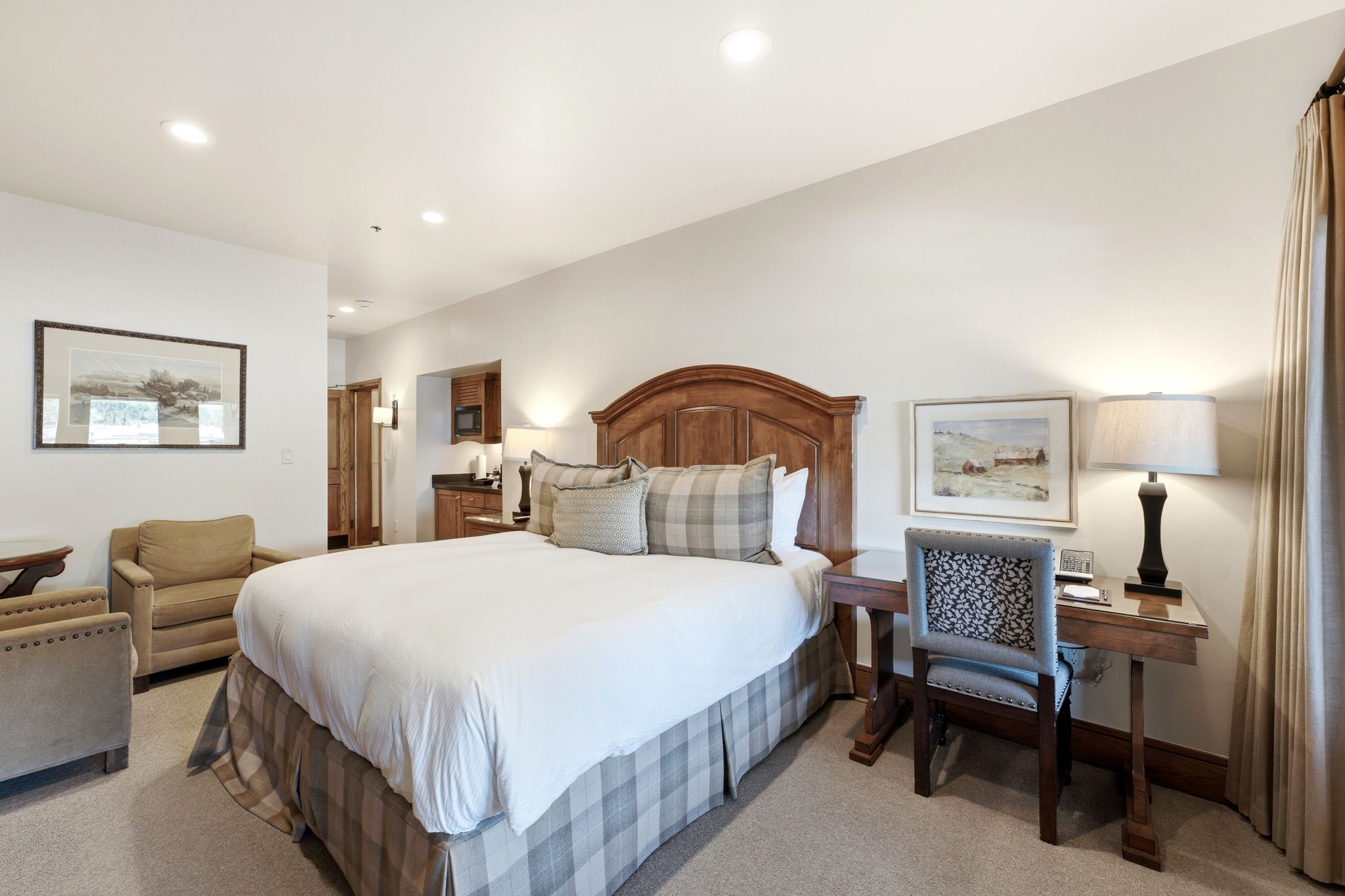Bedroom featuring a wood-finish headboard, recessed lighting, and carpet flooring