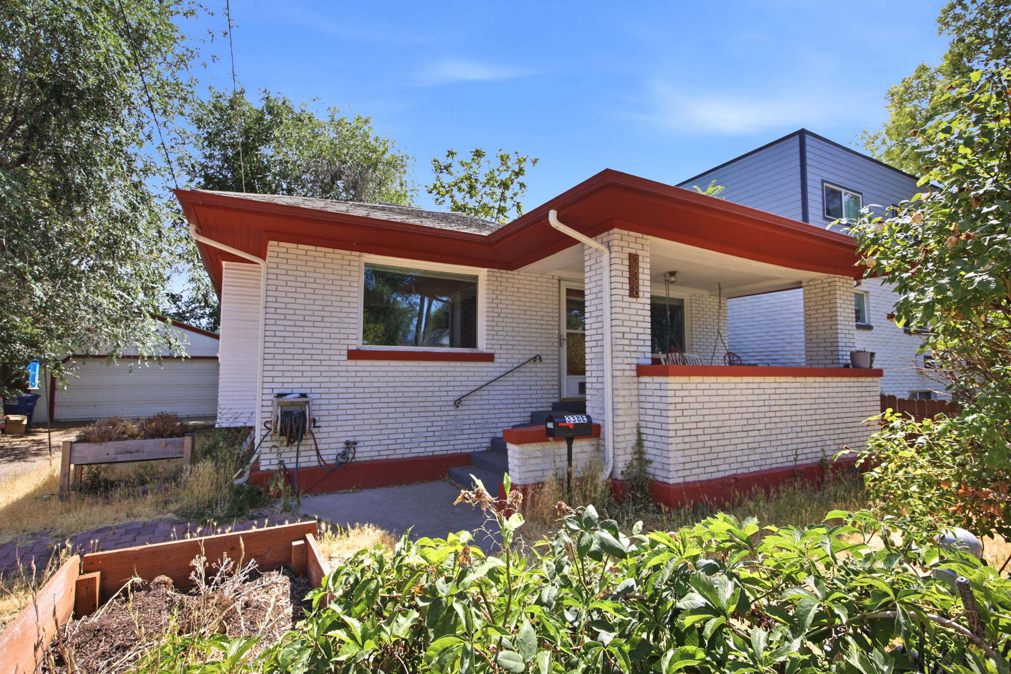 White brick exterior with red trim