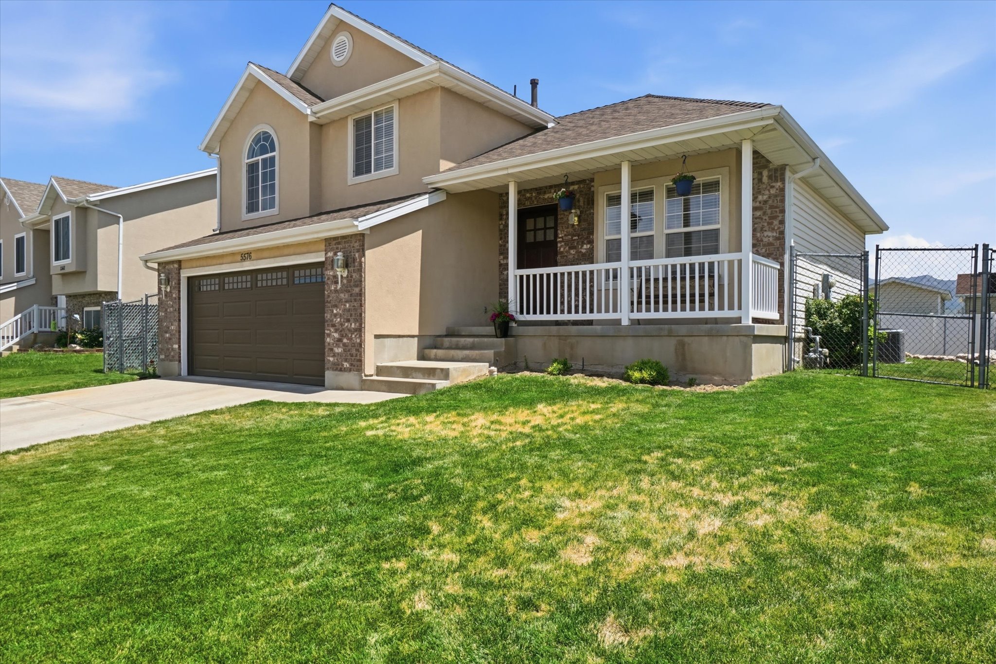 Front/side view of multi-level home and front porch