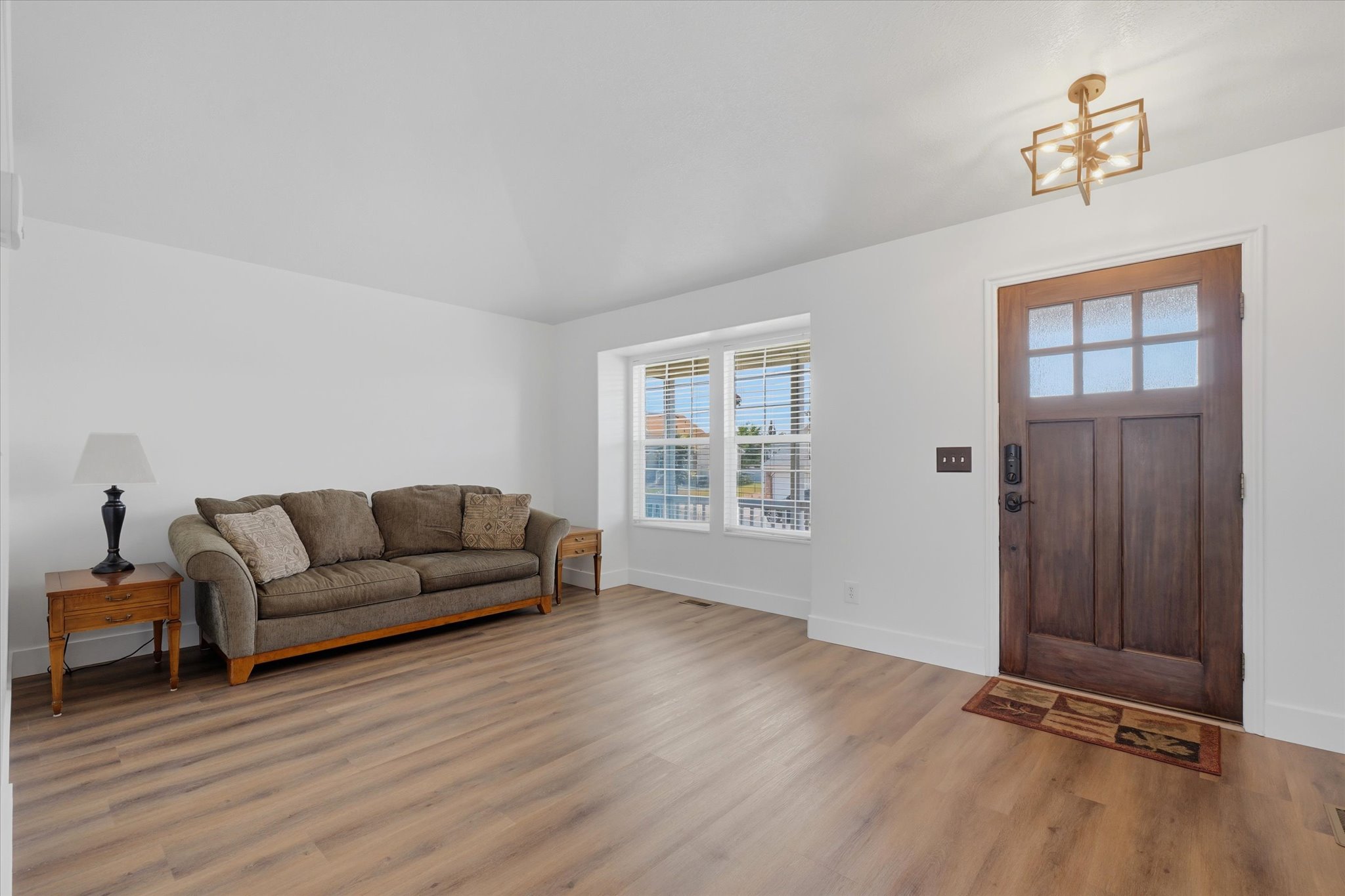 Fresh paint and LVP flooring living room and front door