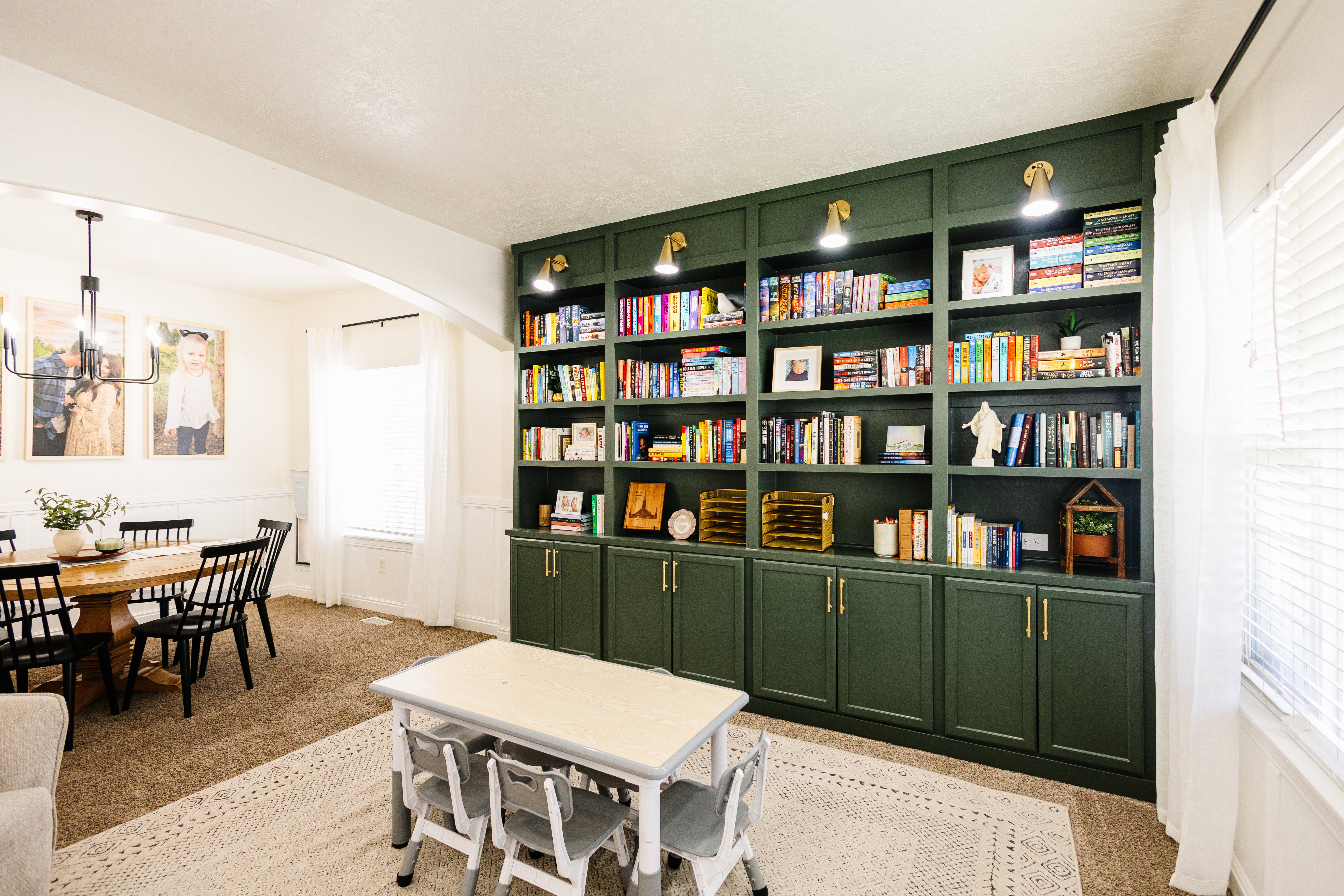 Custom built-in shelving with integrated lighting and lower cabinetry