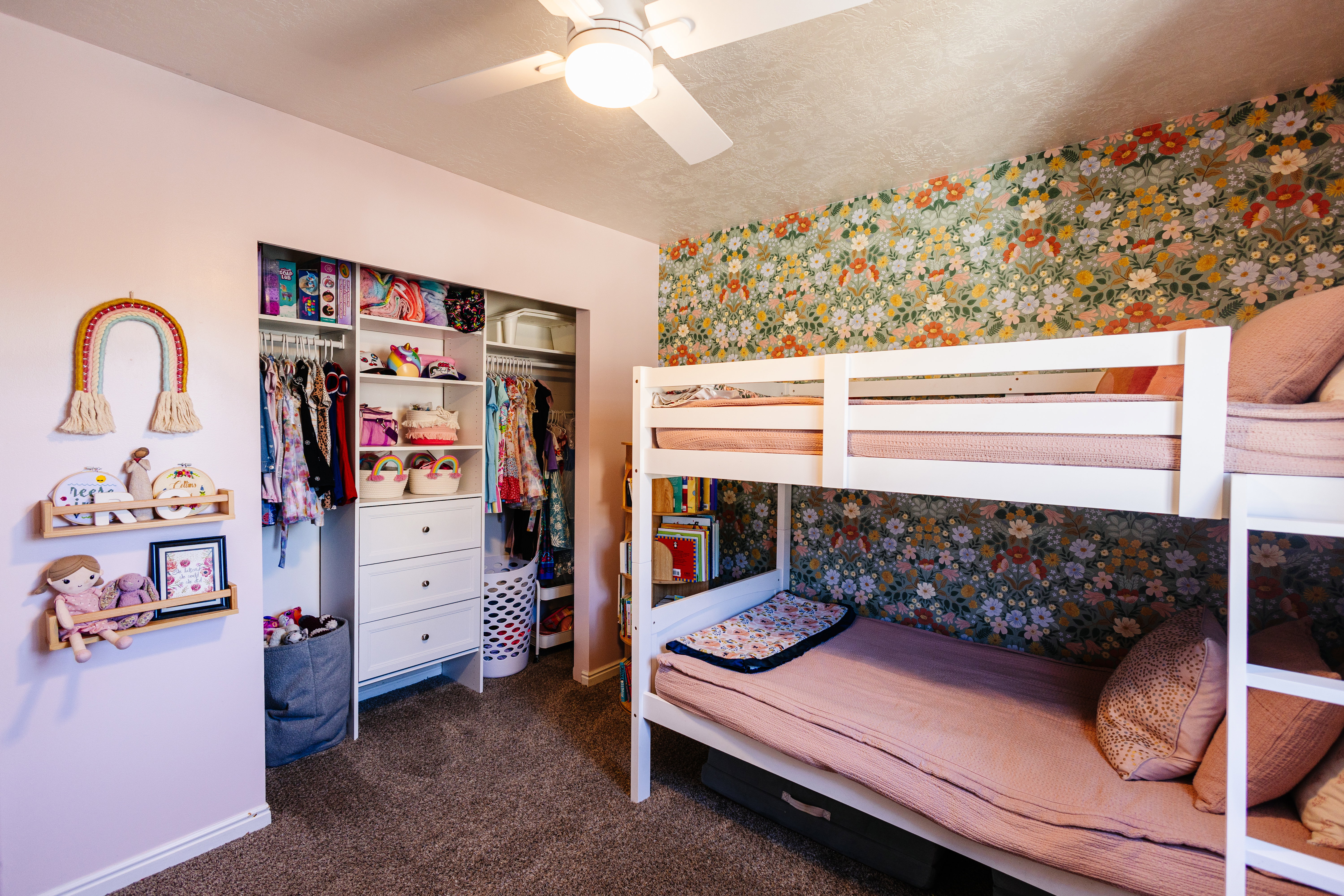 Built-in closet organization system featuring shelving and drawers