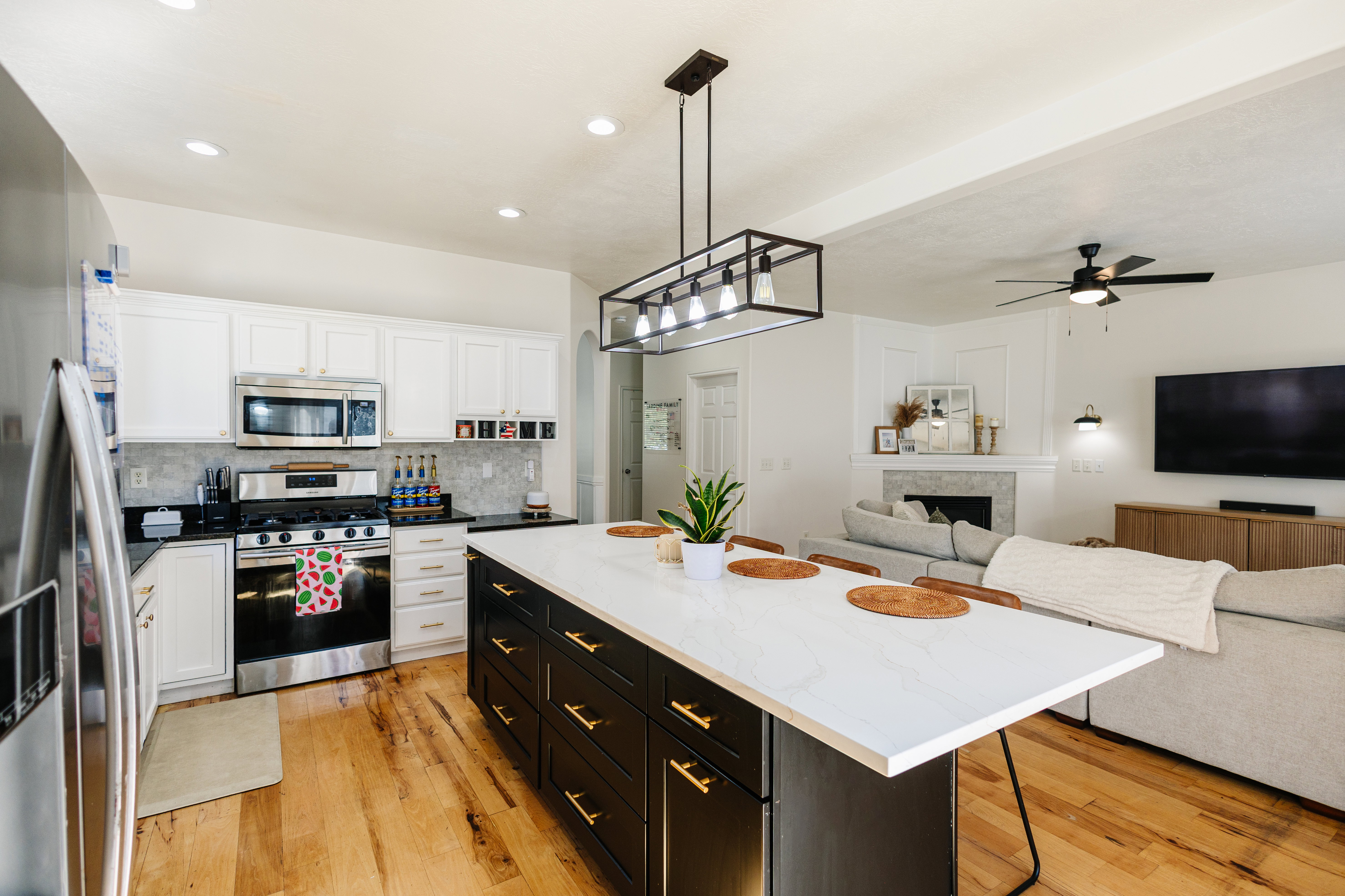 Open-concept living space with wood-finish flooring