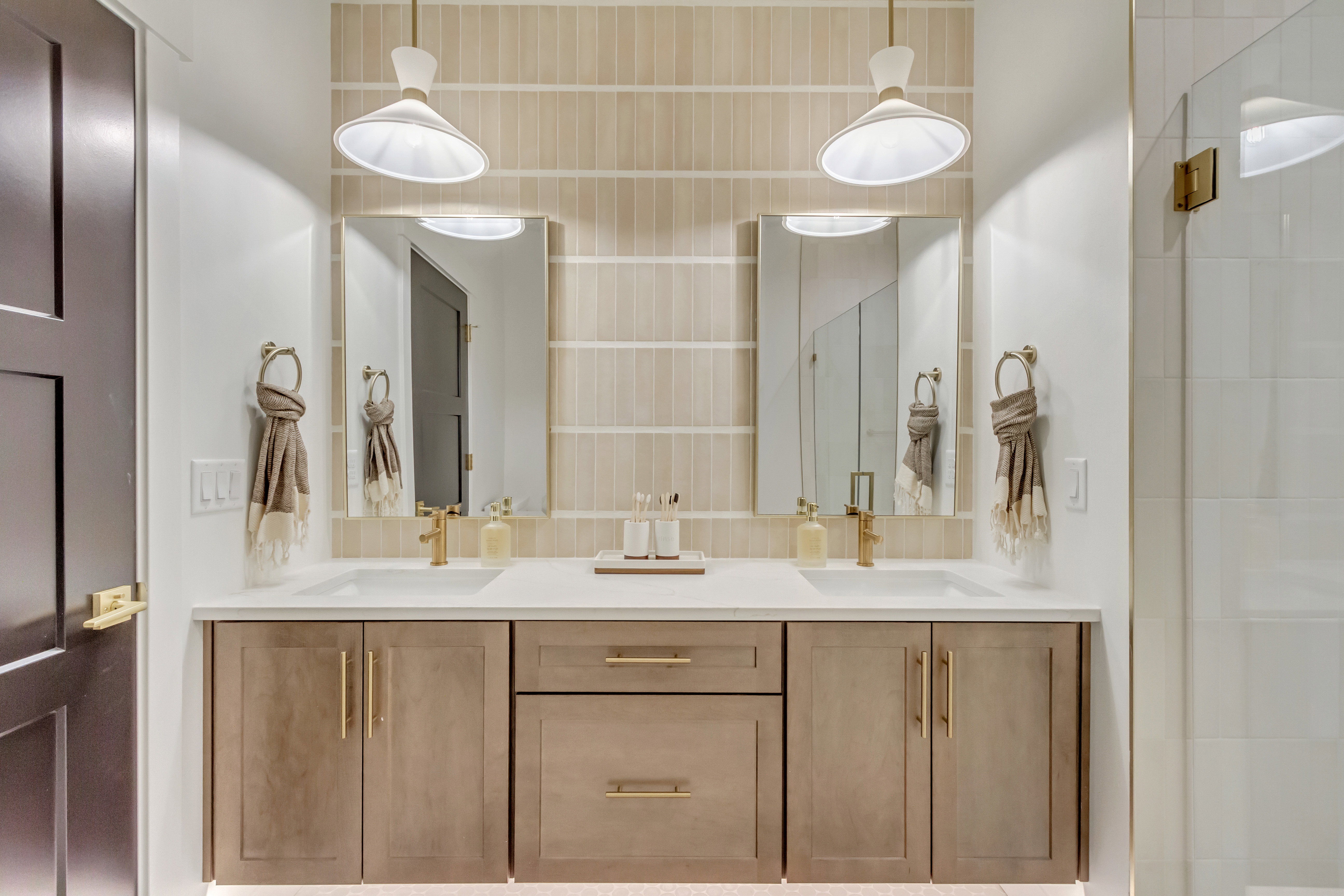 Dual vanity with a white countertop and integrated sinks