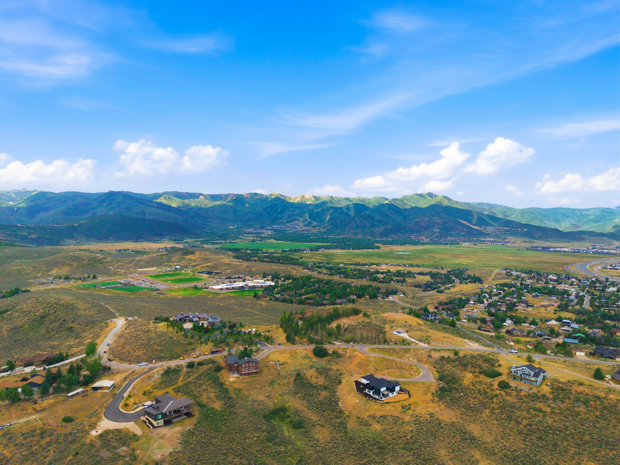 Hillside property featuring multiple building sites with paved road access
