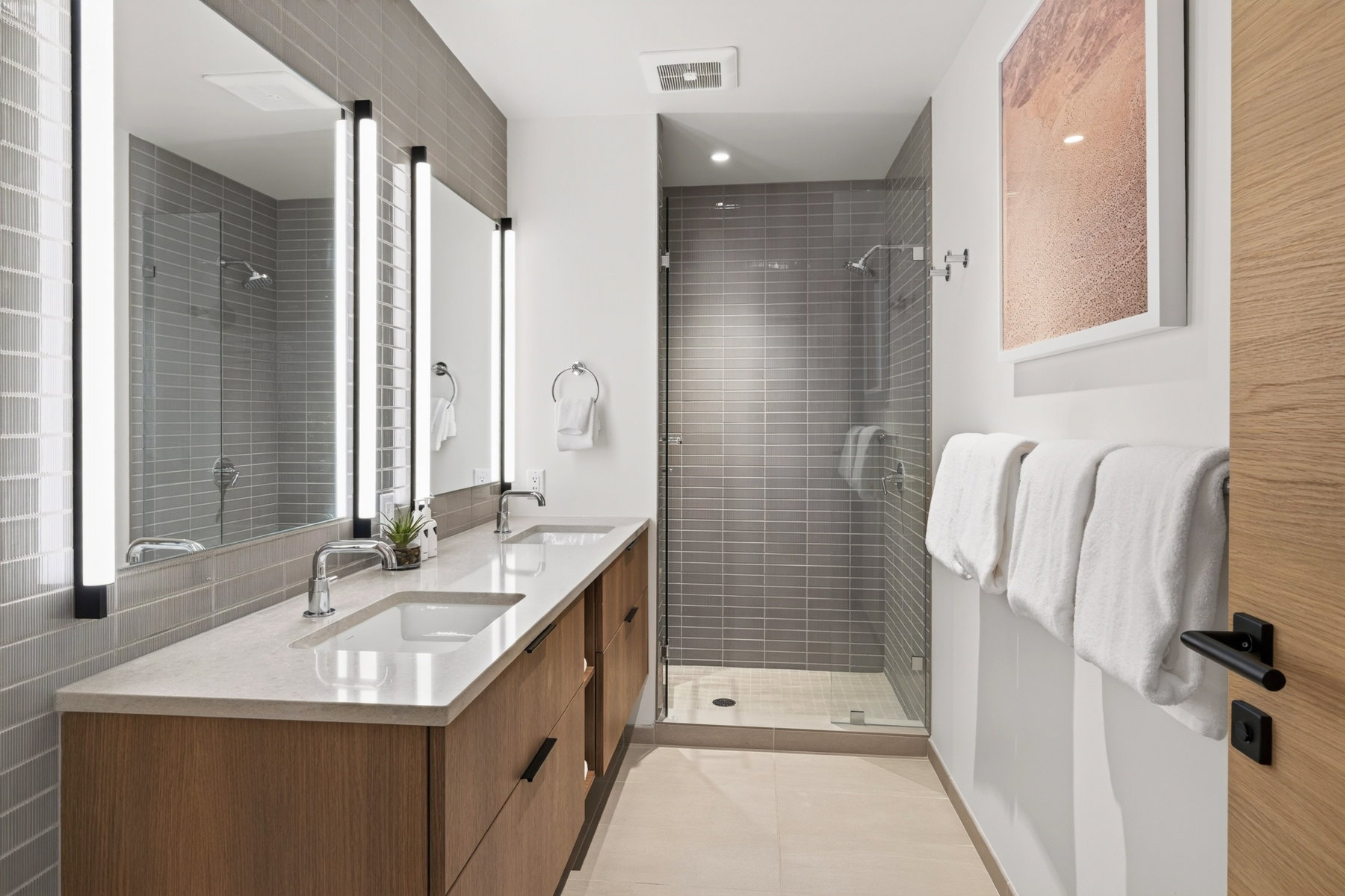 Dual vanity with integrated sinks and a light-toned countertop