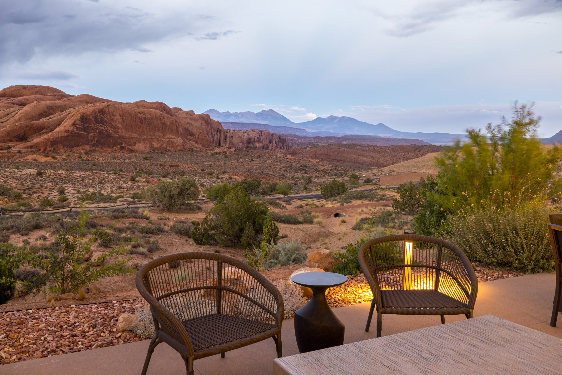 Expansive patio overlooking a desert landscape with distant mountains