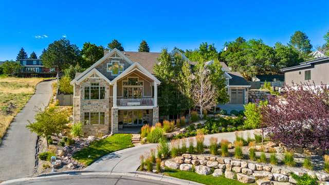 Stone and siding exterior with gabled roof lines