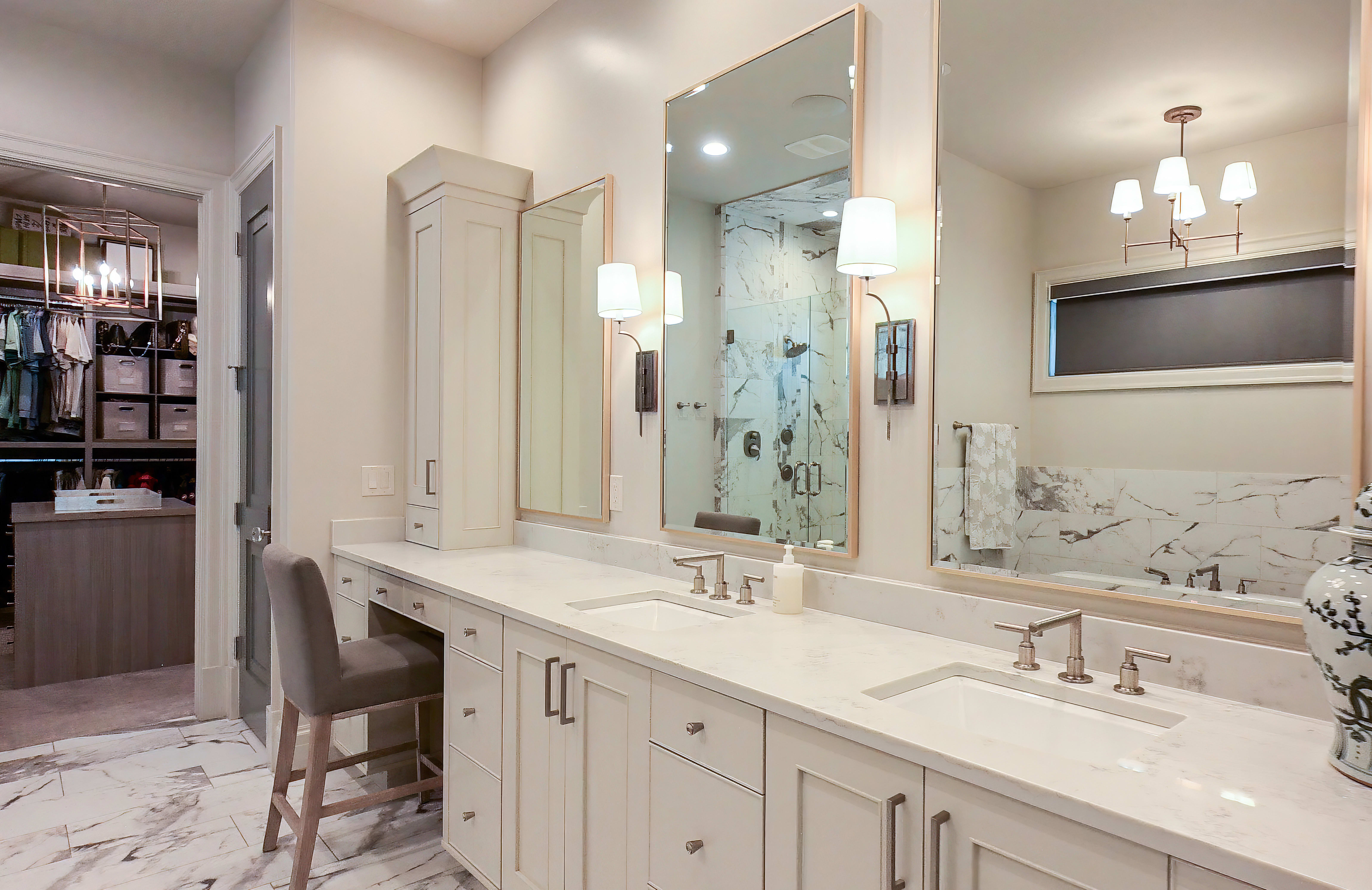 Dual vanity with undermount sinks and light-toned countertops