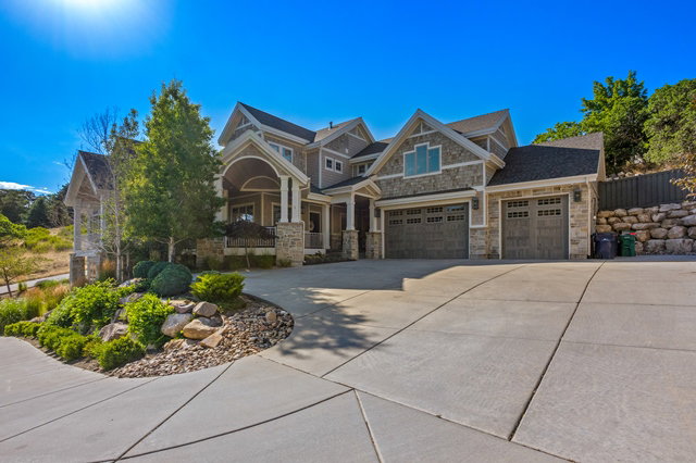 Craftsman-style exterior featuring stone and siding finishes