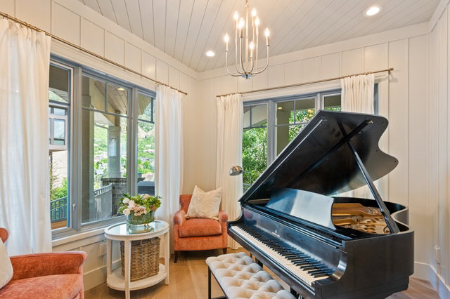Room featuring multiple windows, planked wood-finish ceiling, recessed lighting, and a prominent chandelier