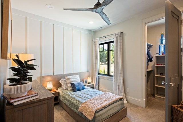 Bedroom featuring board and batten accent wall, recessed lighting, and a modern ceiling fan