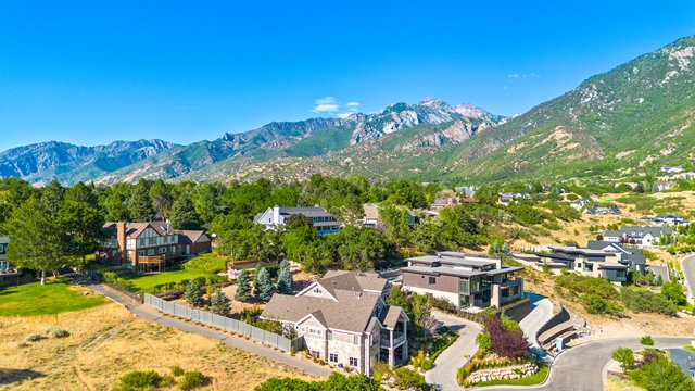 Mountain landscape with multiple residences showcasing varied architectural styles