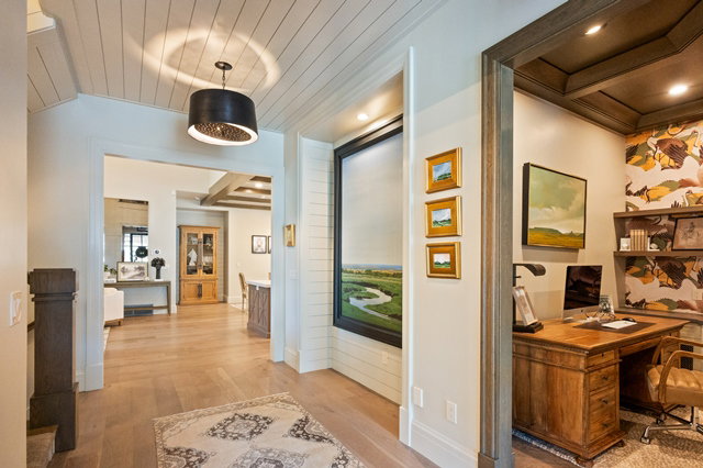 Interior entryway featuring wood-finish flooring and a decorative chandelier