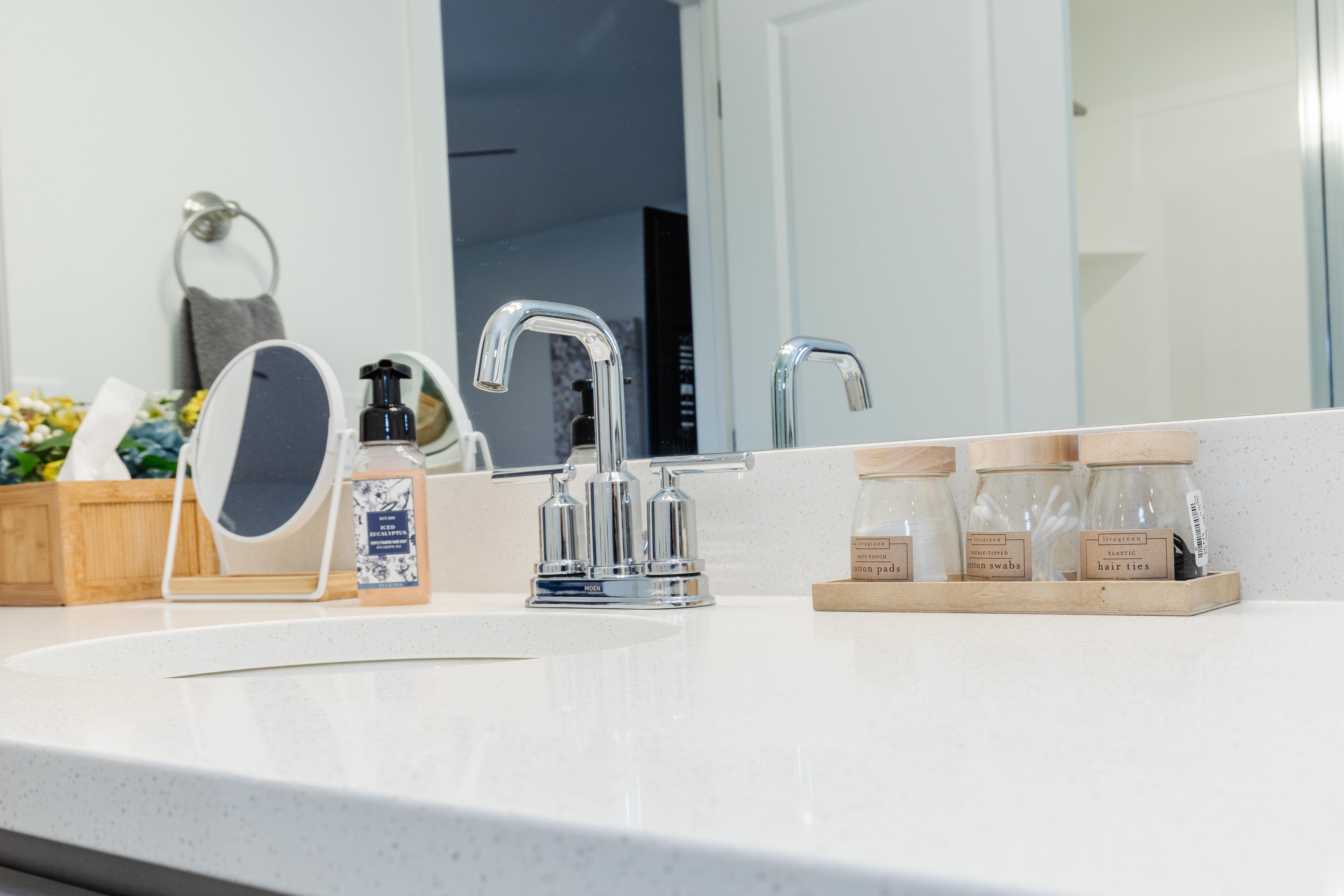 White countertop with integrated sink and chrome faucet
