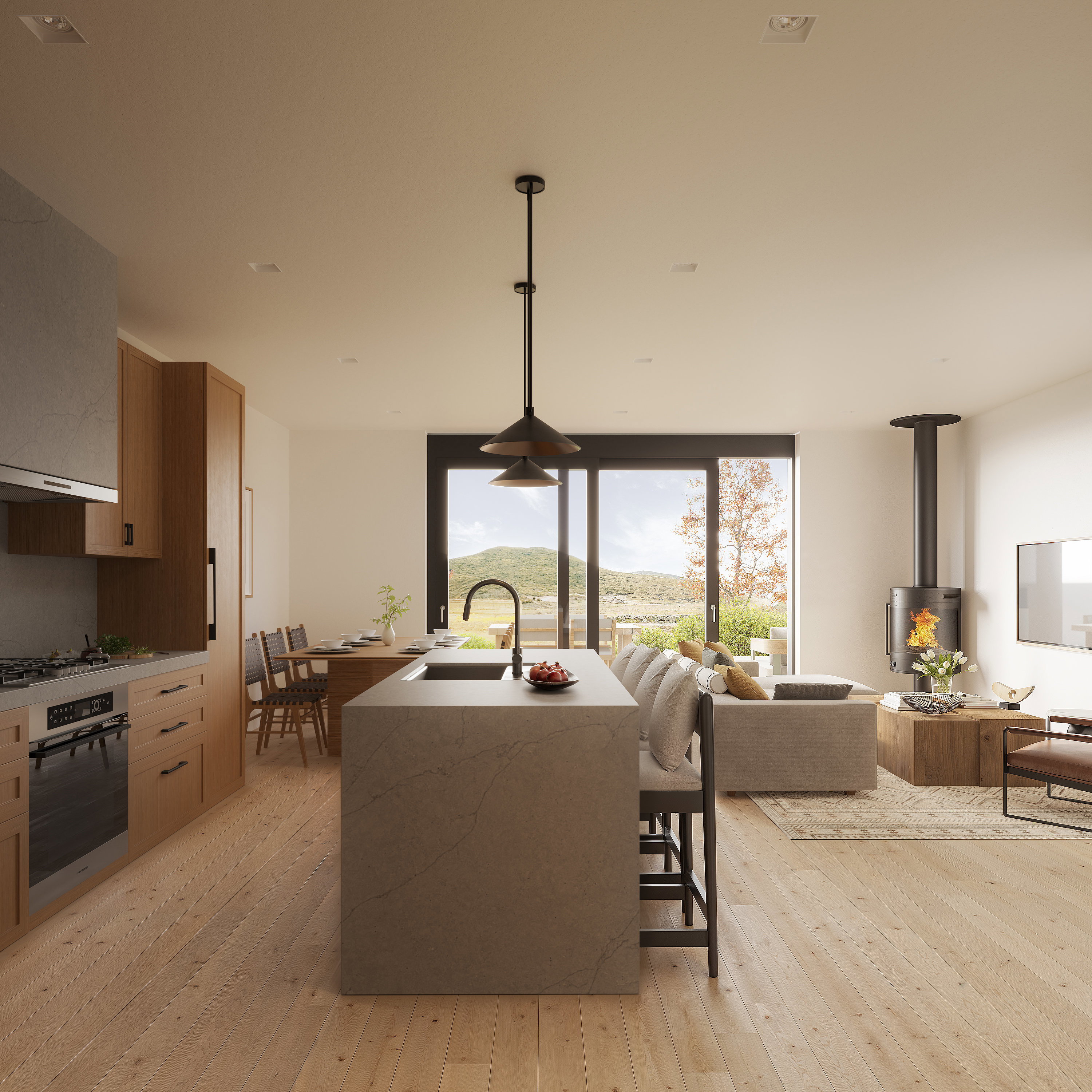 Open-concept living area featuring a large kitchen island with integrated sink, wood-finish flooring, a contemporary freestanding fireplace, and expansive sliding glass doors