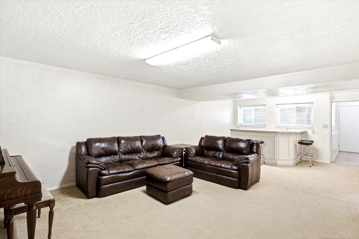 Large family room with kitchenette. Gas line plumbed in wall for future kitchen