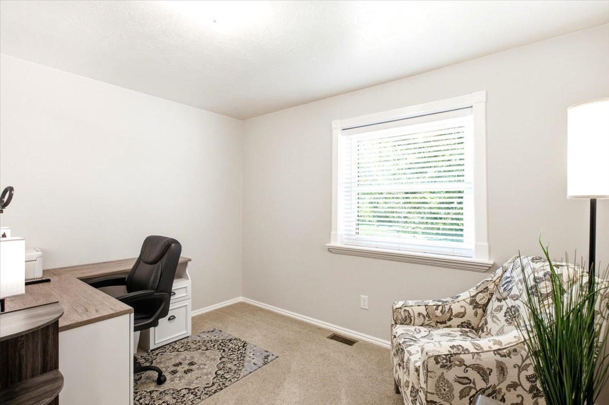 Can be utilized as a bedroom with a wardrobe, or the closet can be added back in. Also well suited as an office or den