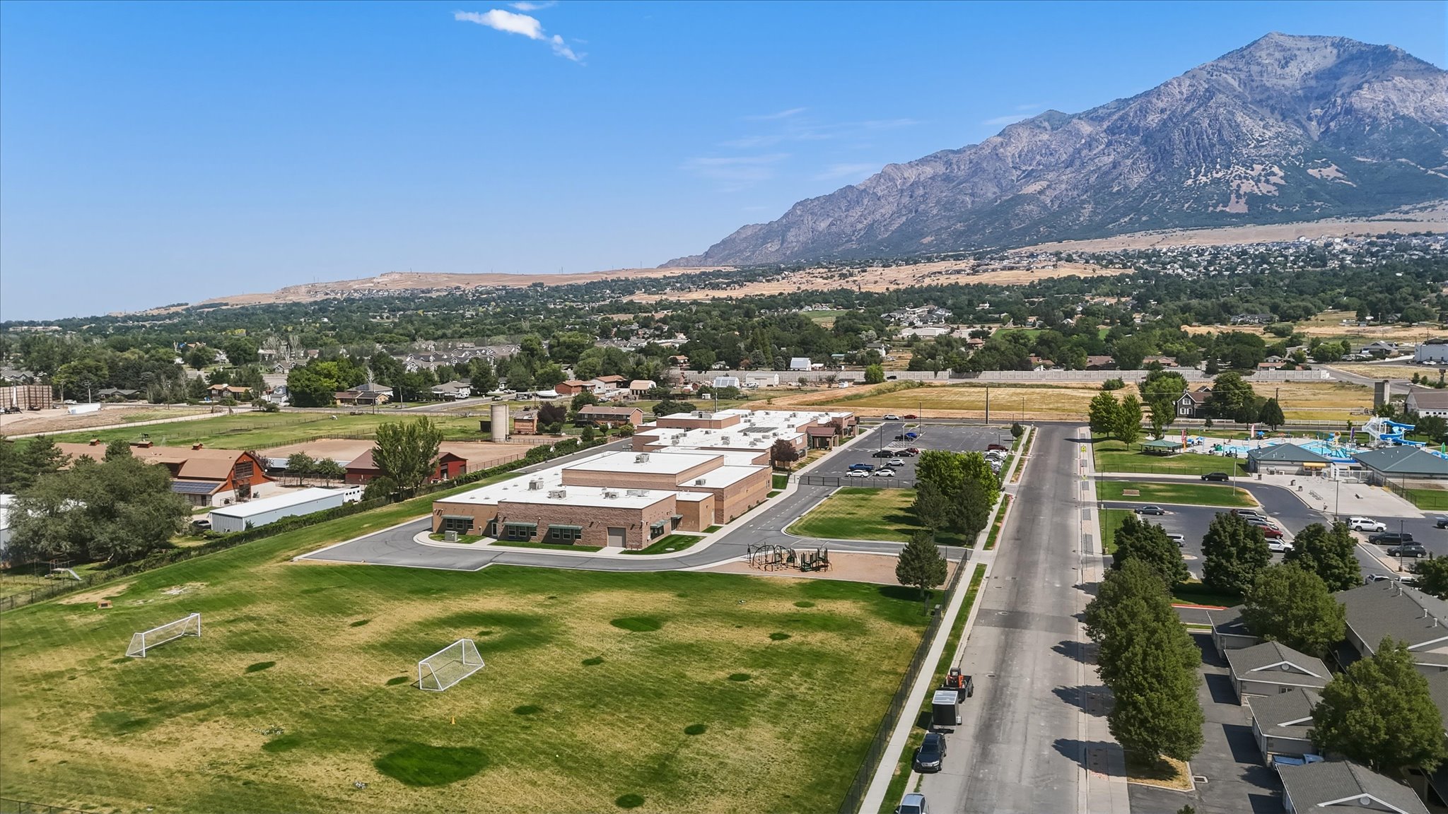 Aerial perspective showcasing the surrounding landscape with a prominent mountain backdrop