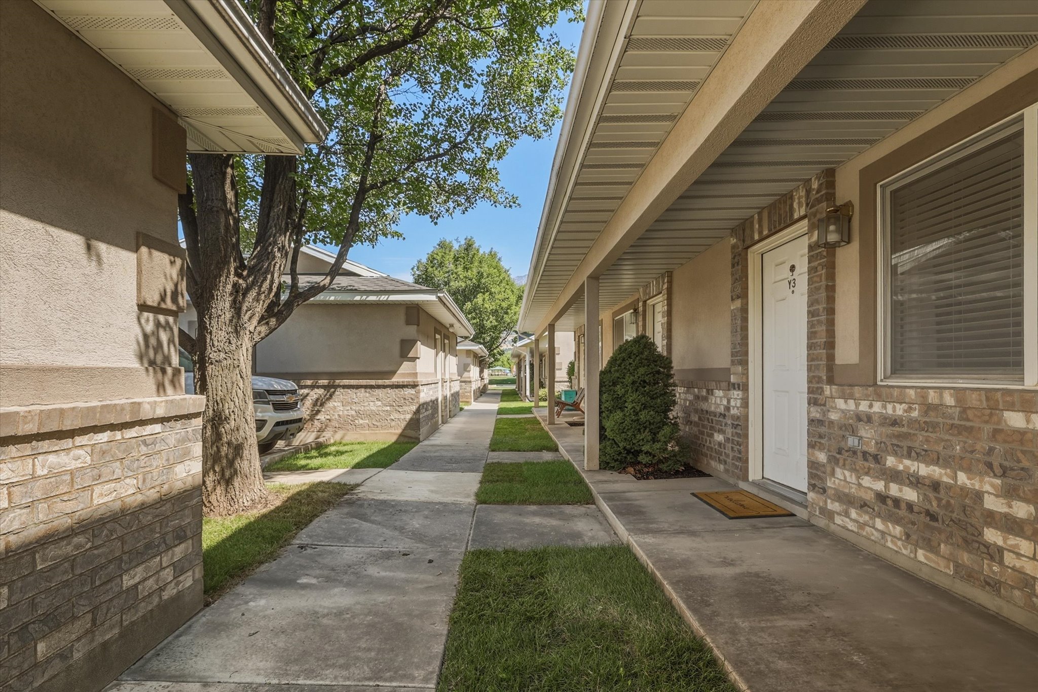 Exterior facade featuring brick accents and stucco siding