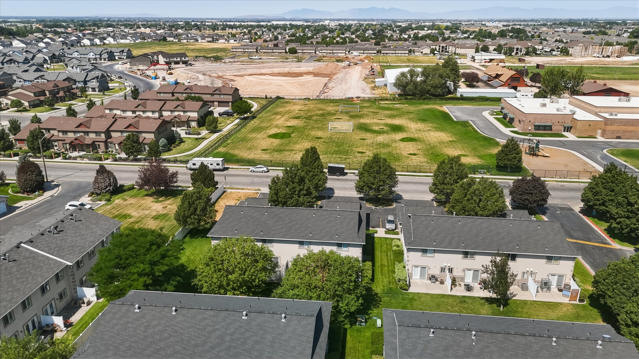 Aerial perspective showcasing residential developments, open green spaces, and community infrastructure