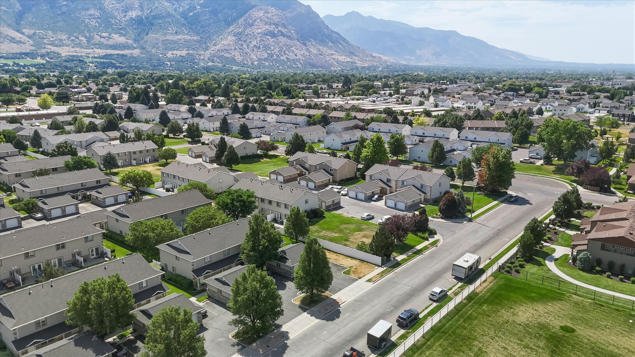 Residential community featuring a variety of housing styles, including multi-story townhomes and single-story residences