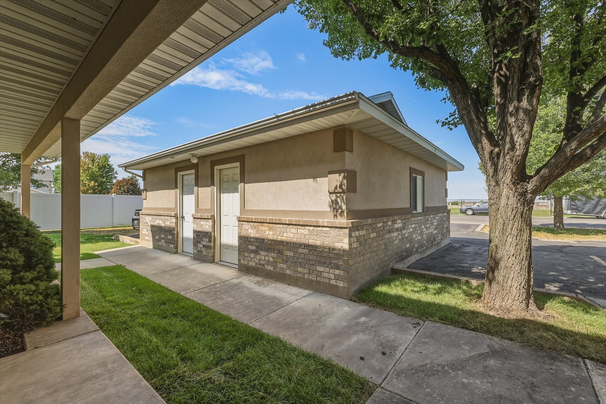 Exterior building featuring stucco and brick veneer siding
