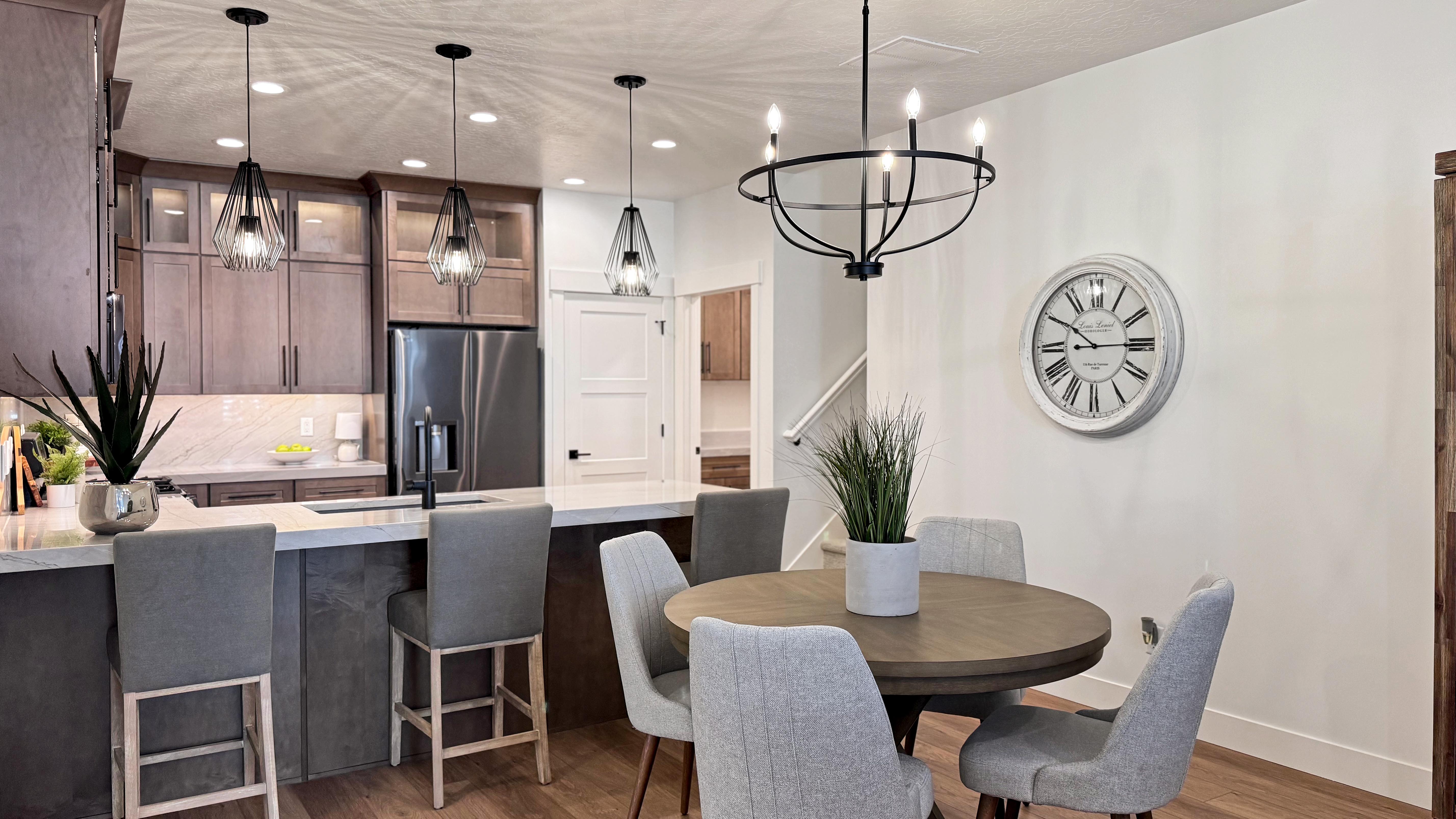 Open-concept living space with wood-finish flooring