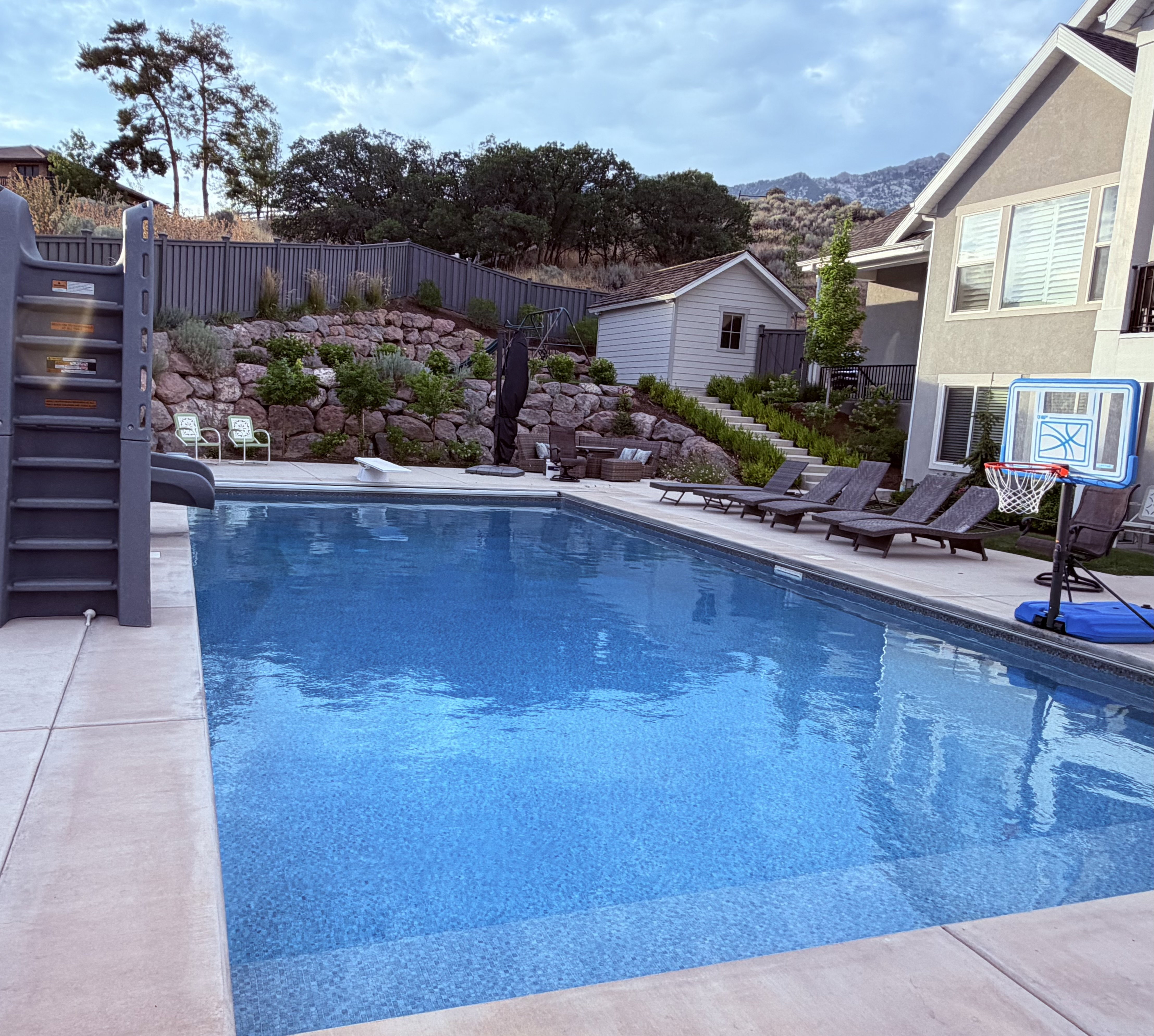Rectangular swimming pool with concrete surround