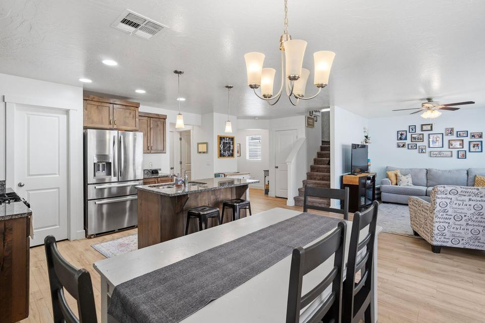 Open-concept living area with wood-finish flooring