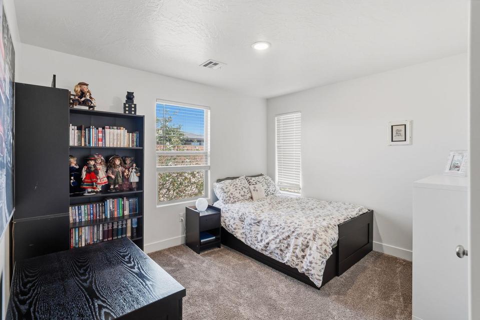 Neutral wall tones complement plush carpeting