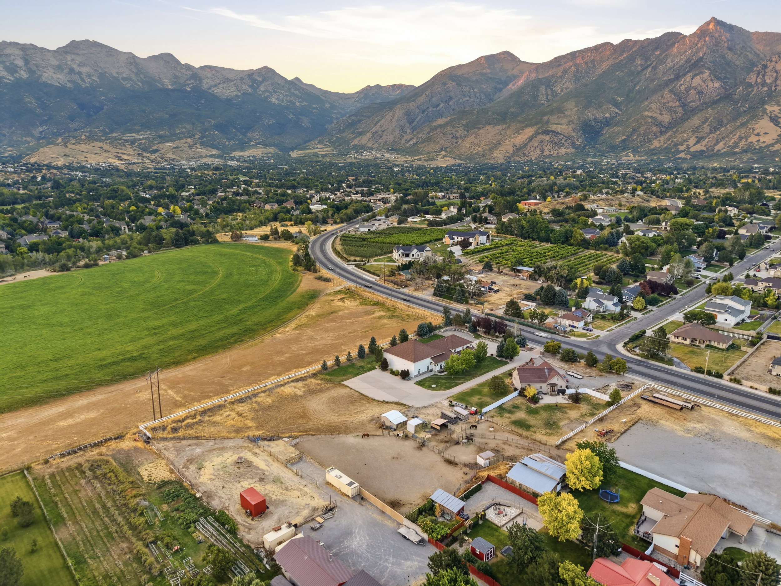 Expansive mountain range backdrop framing a residential area with varied housing styles
