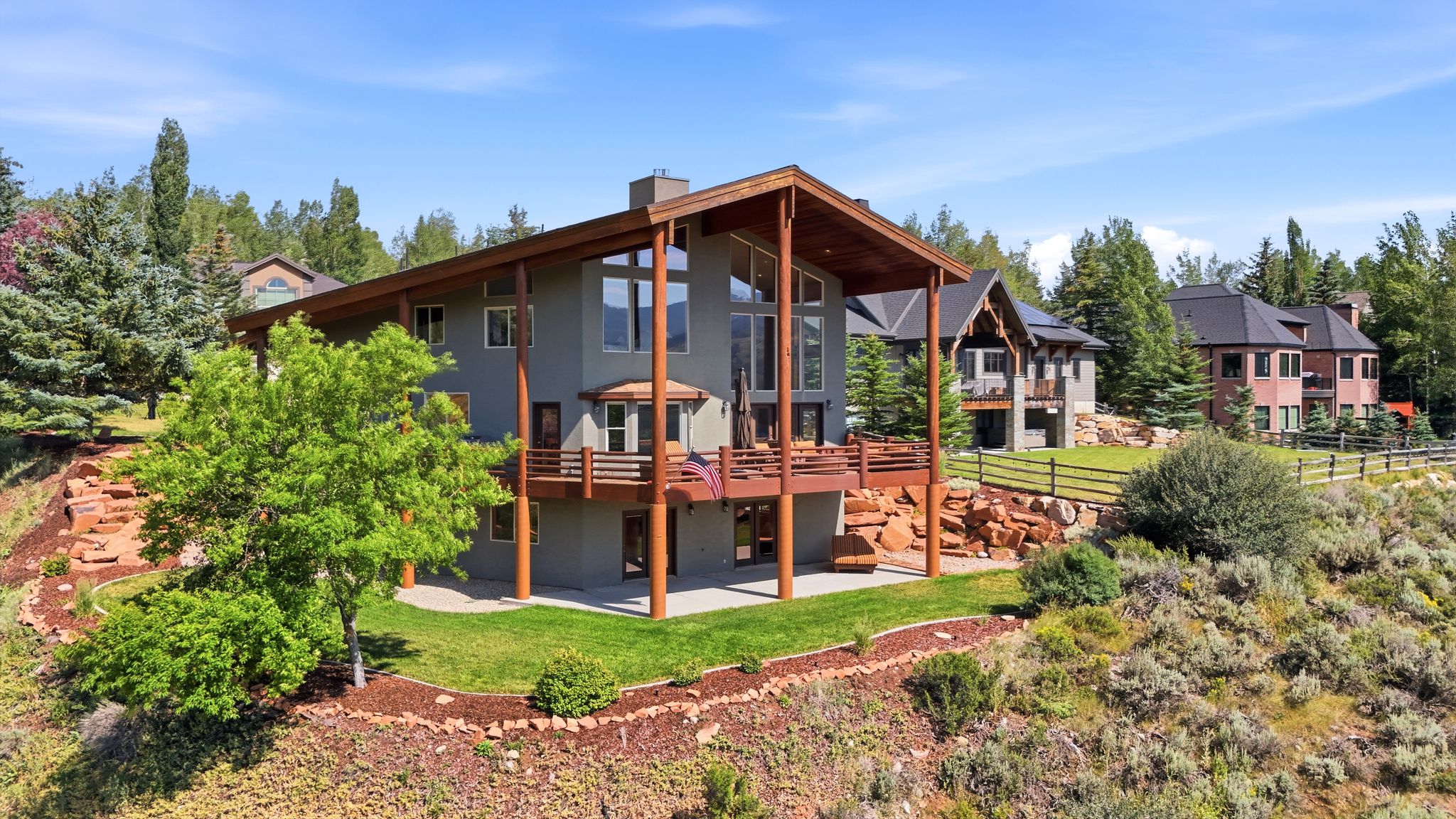 Contemporary residence featuring extensive glazing and a multi-level deck