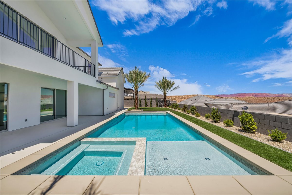 Contemporary exterior with a private pool and integrated spa