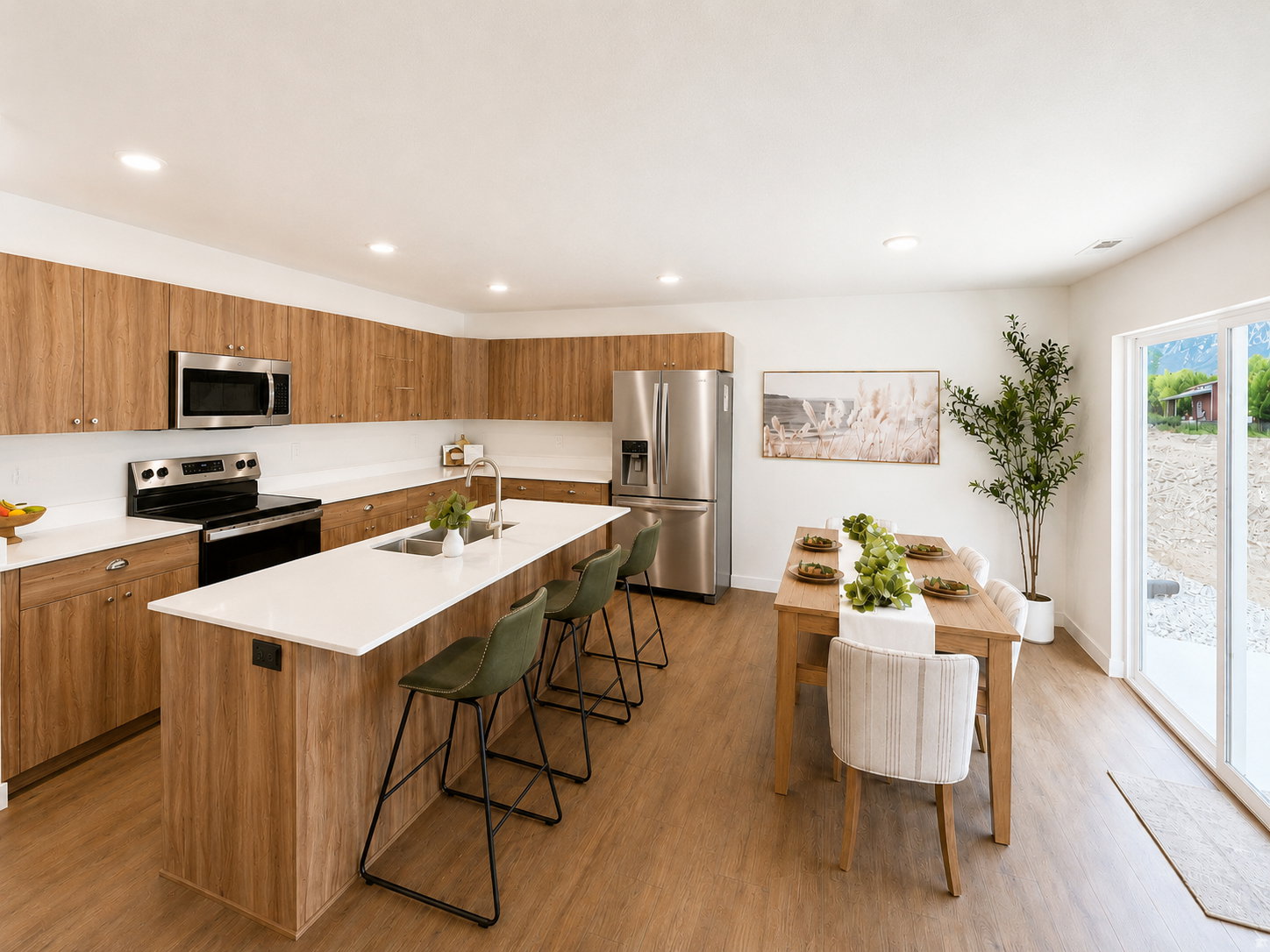 Modern kitchen featuring wood-finish cabinetry, stainless steel appliances, a large island with white countertops, and recessed lighting