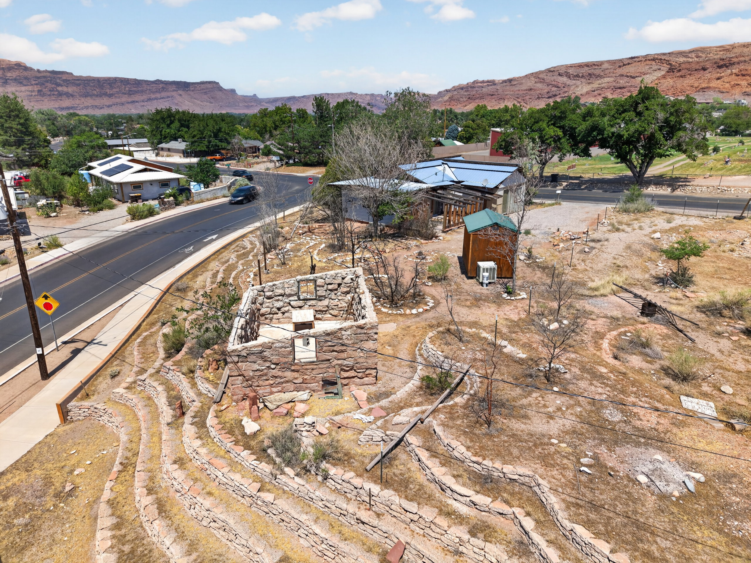 Stone structure with tiered rock landscaping