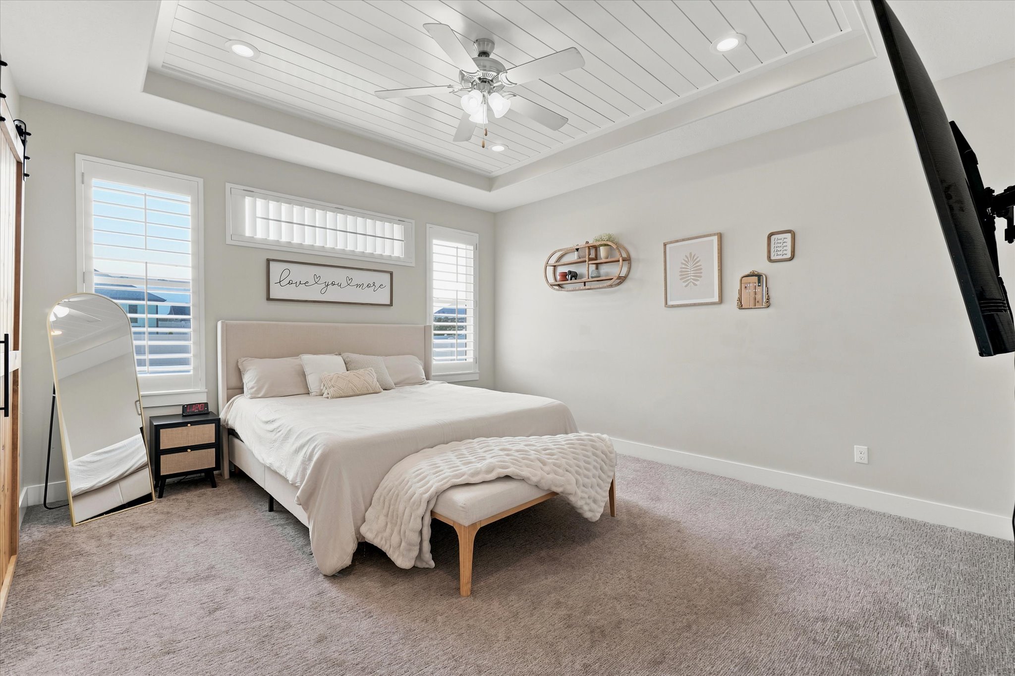 Bedroom featuring a tray ceiling with shiplap detail, recessed lighting, and a ceiling fan