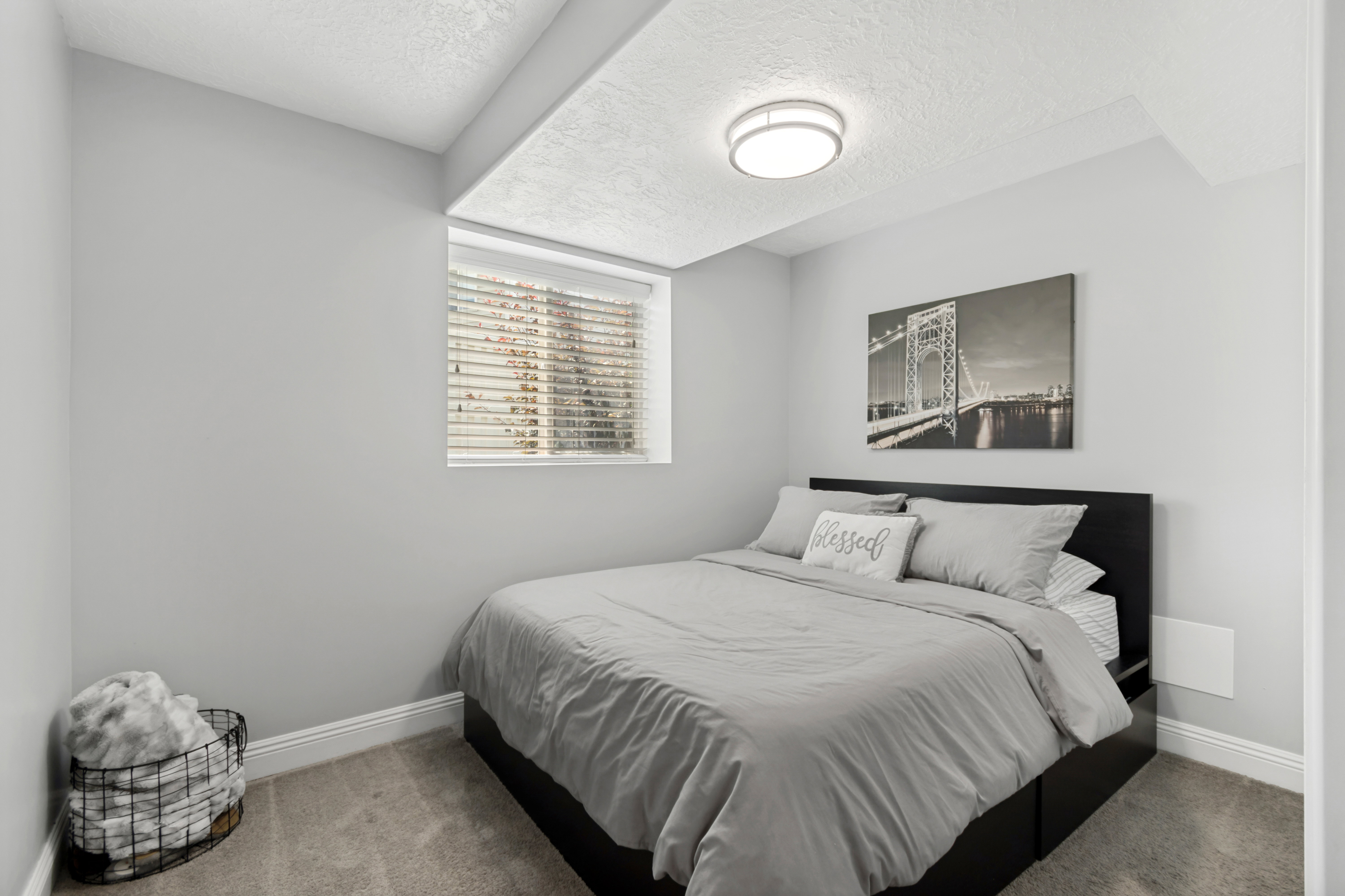 Carpeted room featuring a window with blinds, recessed ceiling, and a flush mount light fixture