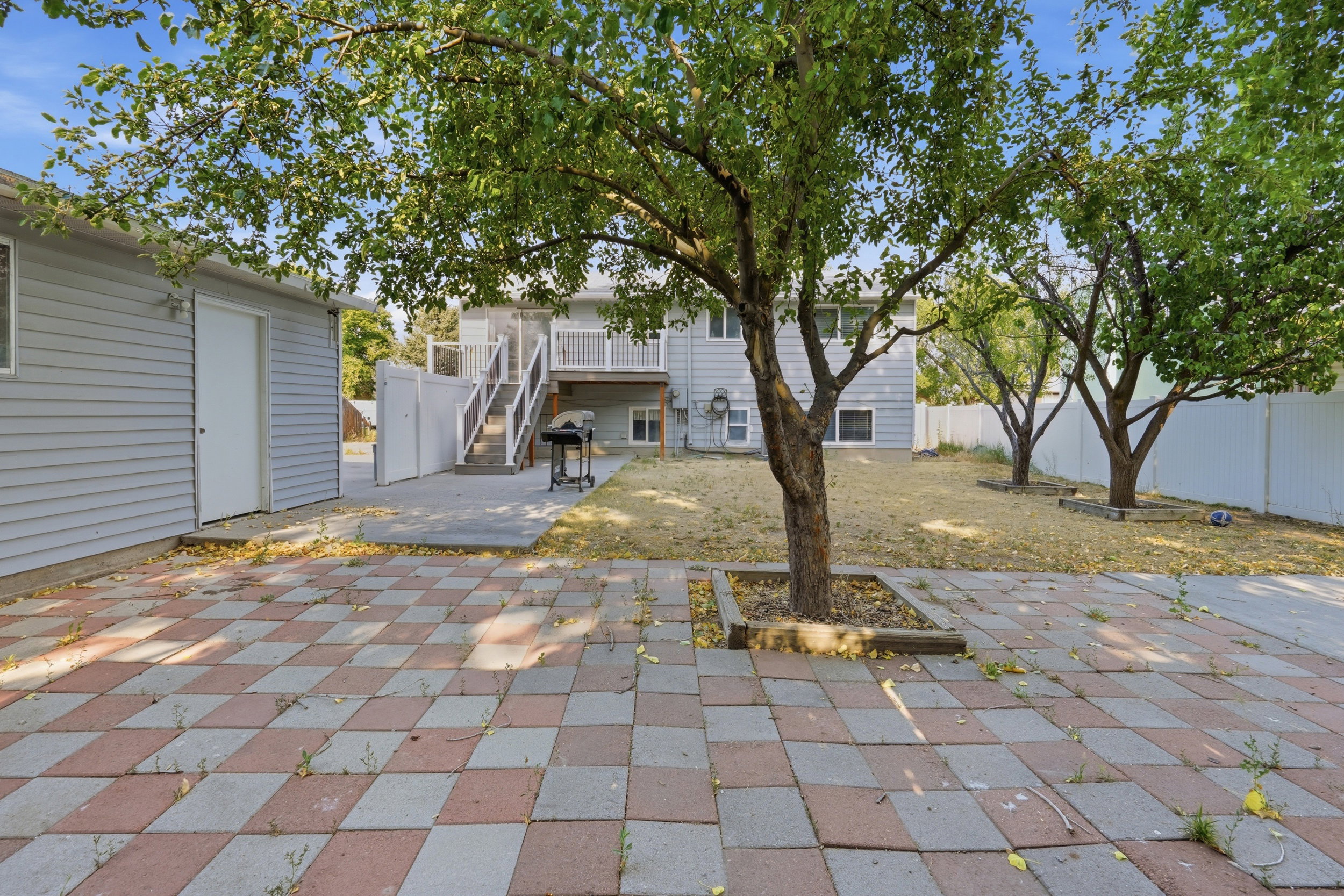 Expansive paver patio featuring a checkered pattern