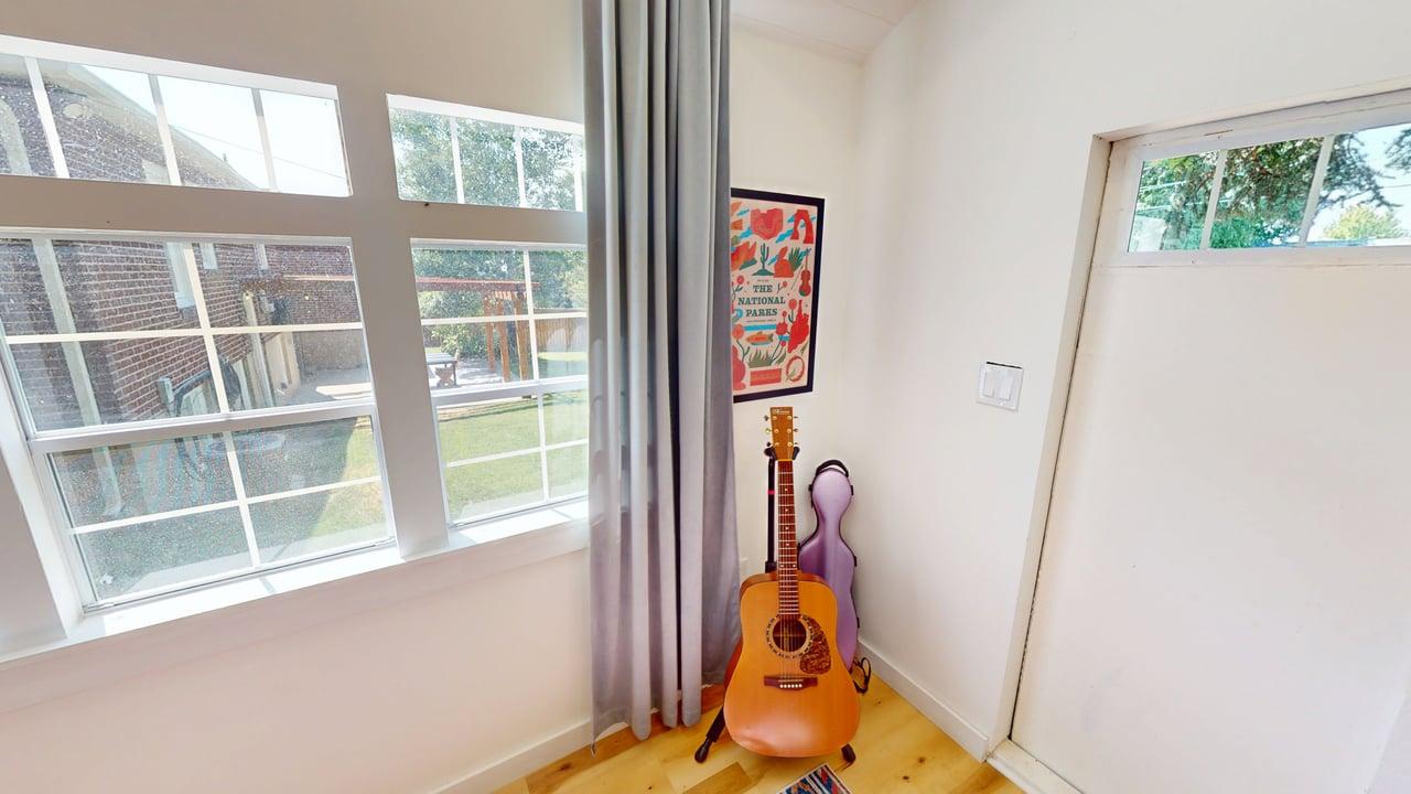 Room featuring multiple pane windows and a solid panel door