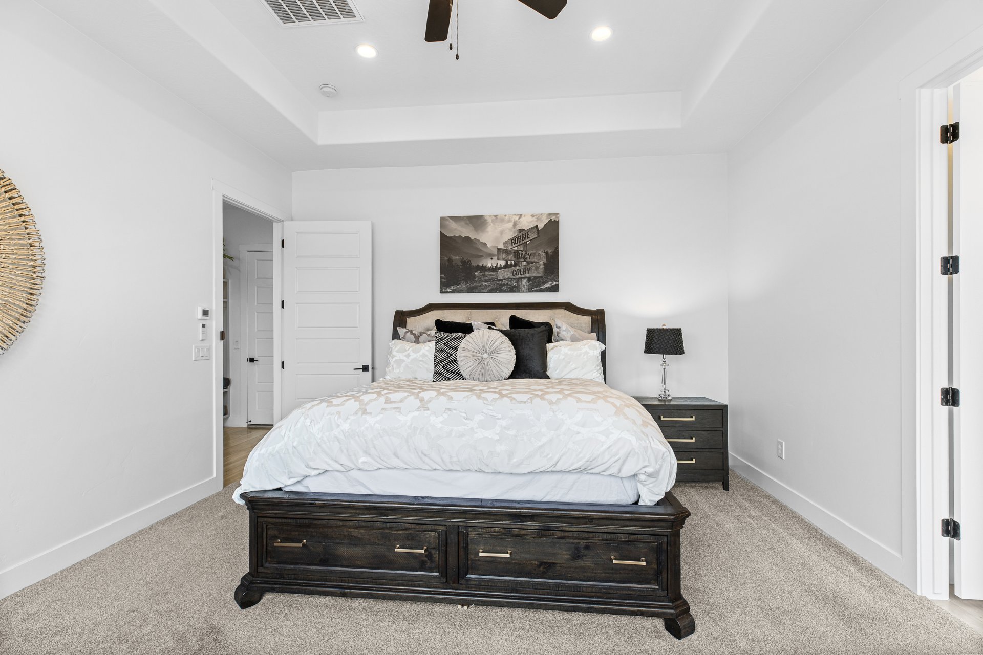 Interior space featuring white walls and neutral-toned carpeting