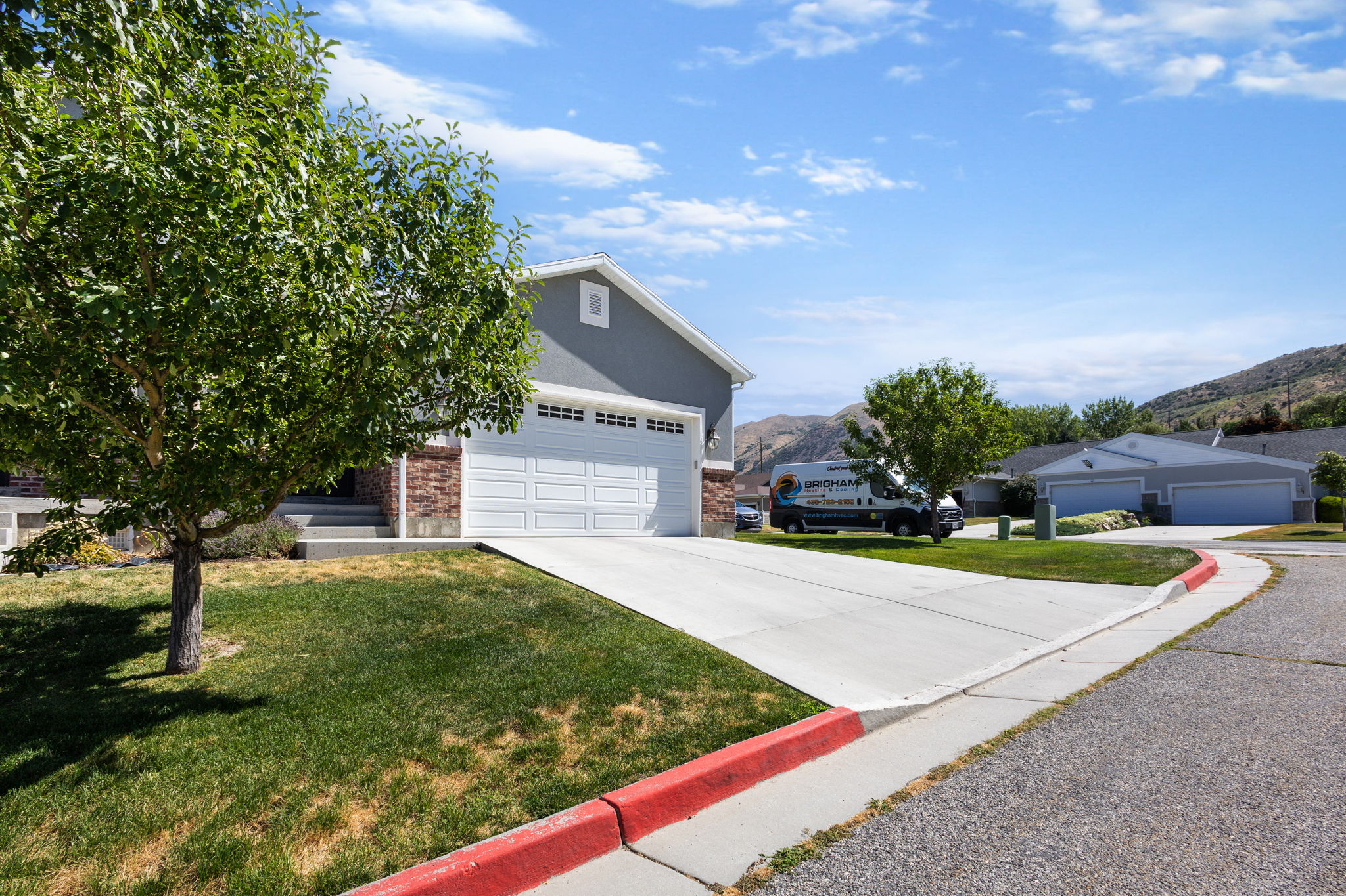 Gray exterior with a white two-car garage