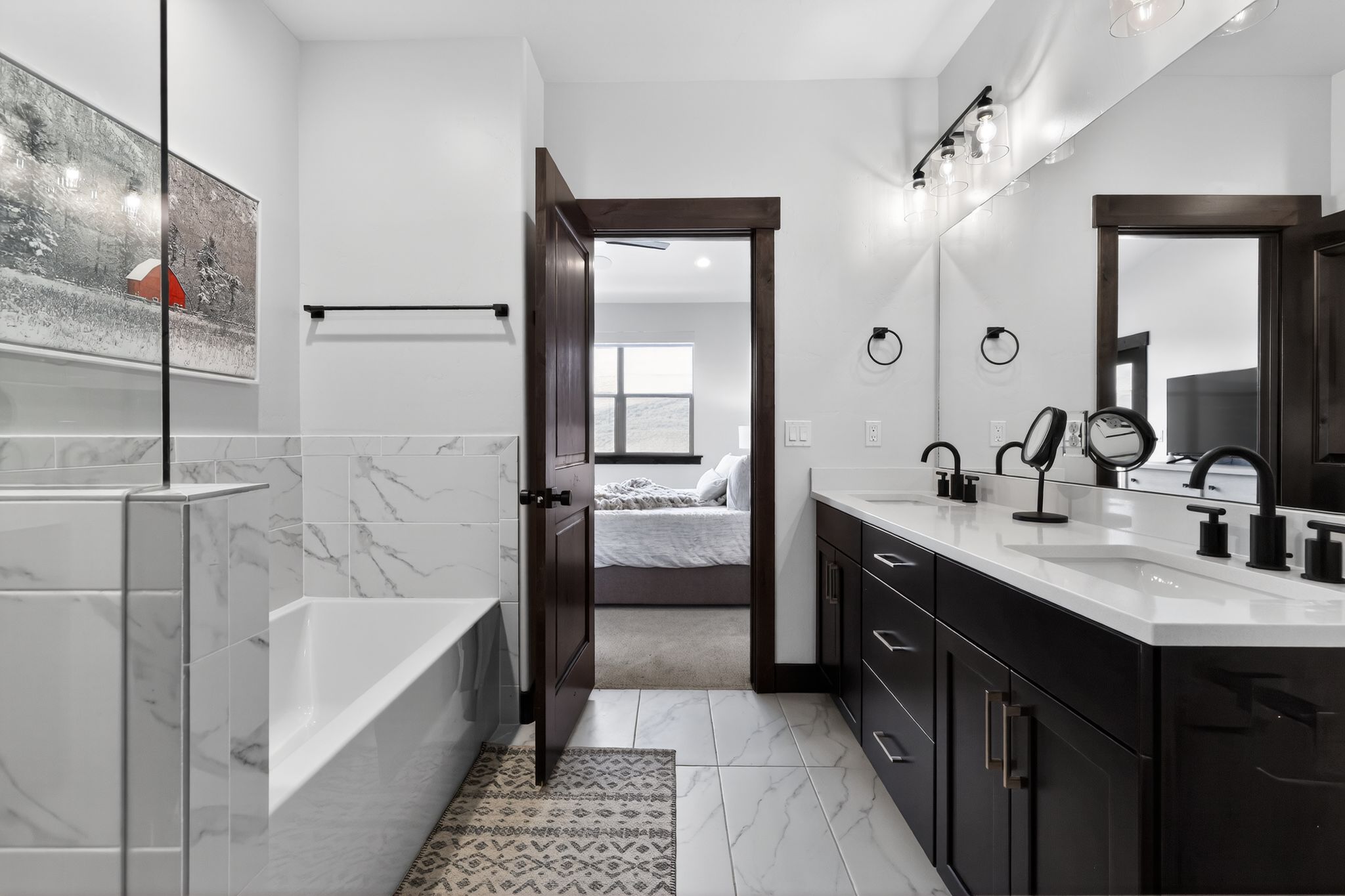 Bathroom featuring a deep soaking tub with marble-look tile surround