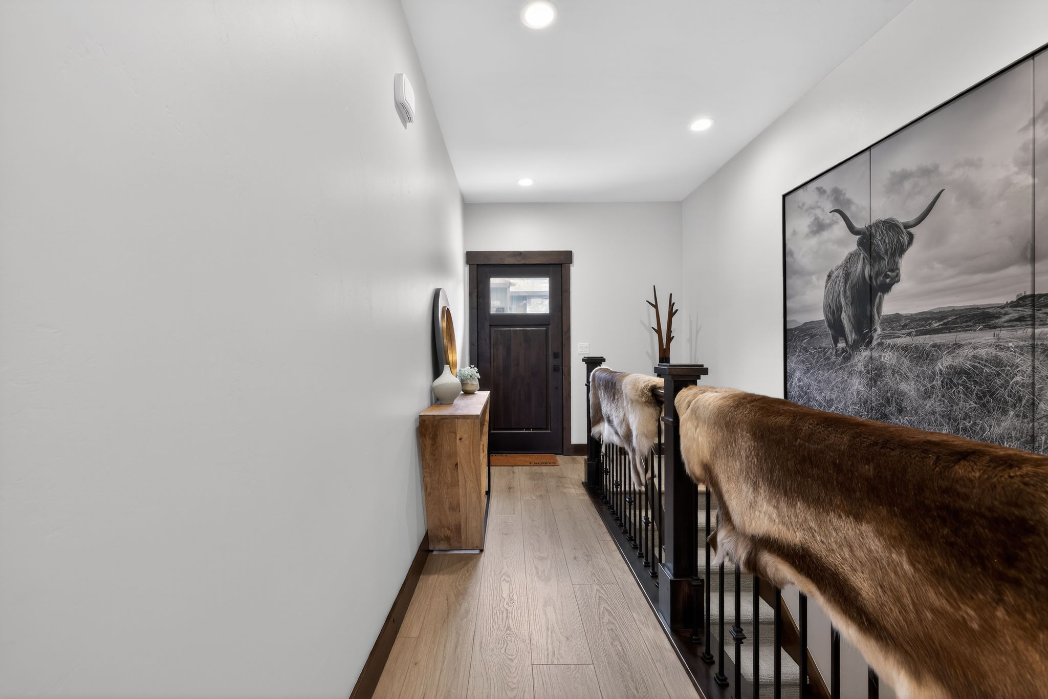 Hardwood-finish flooring extending through the hallway